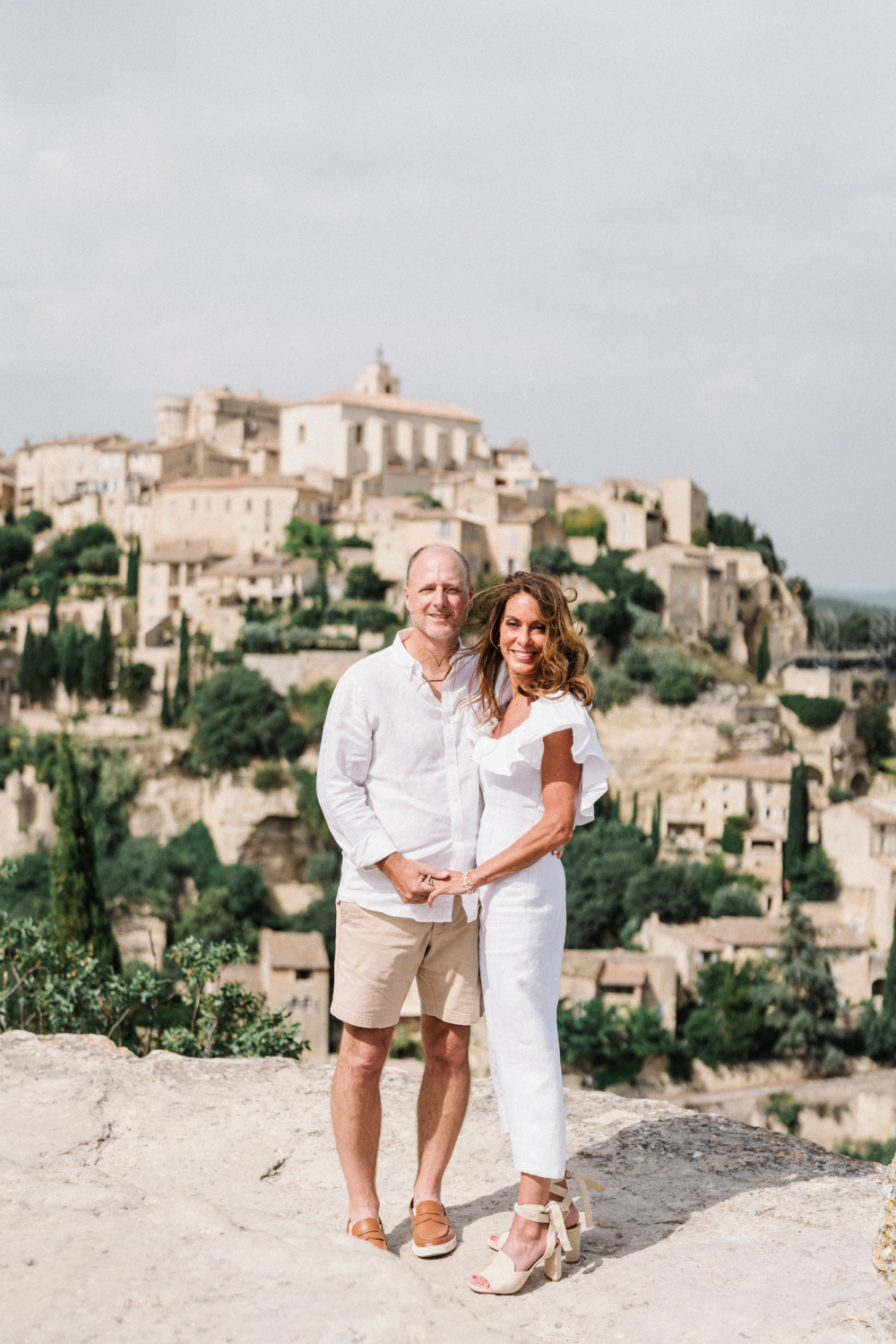 couple hold hands in gordes france