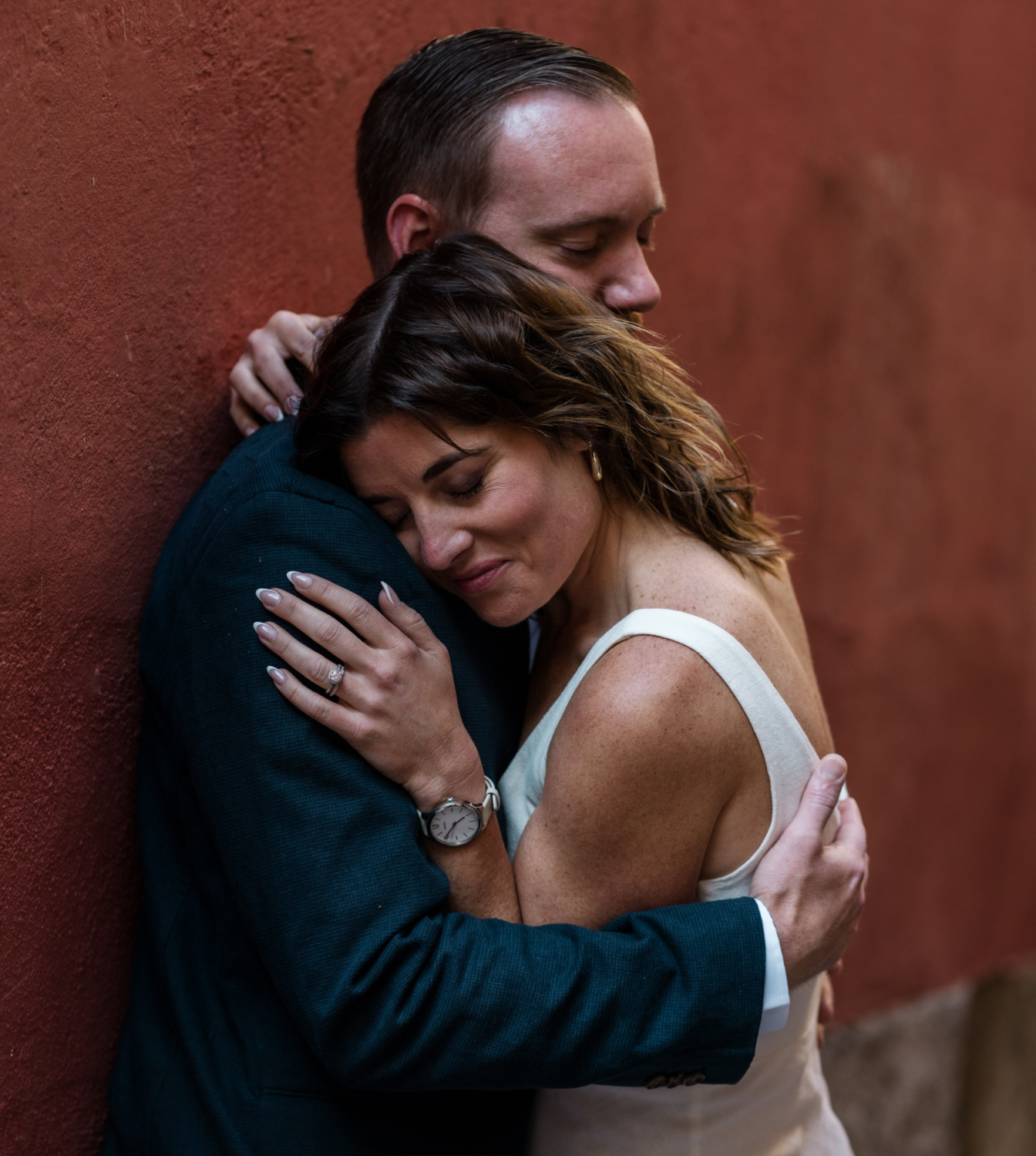 woman lays her head on man's shoulder in old town nice france