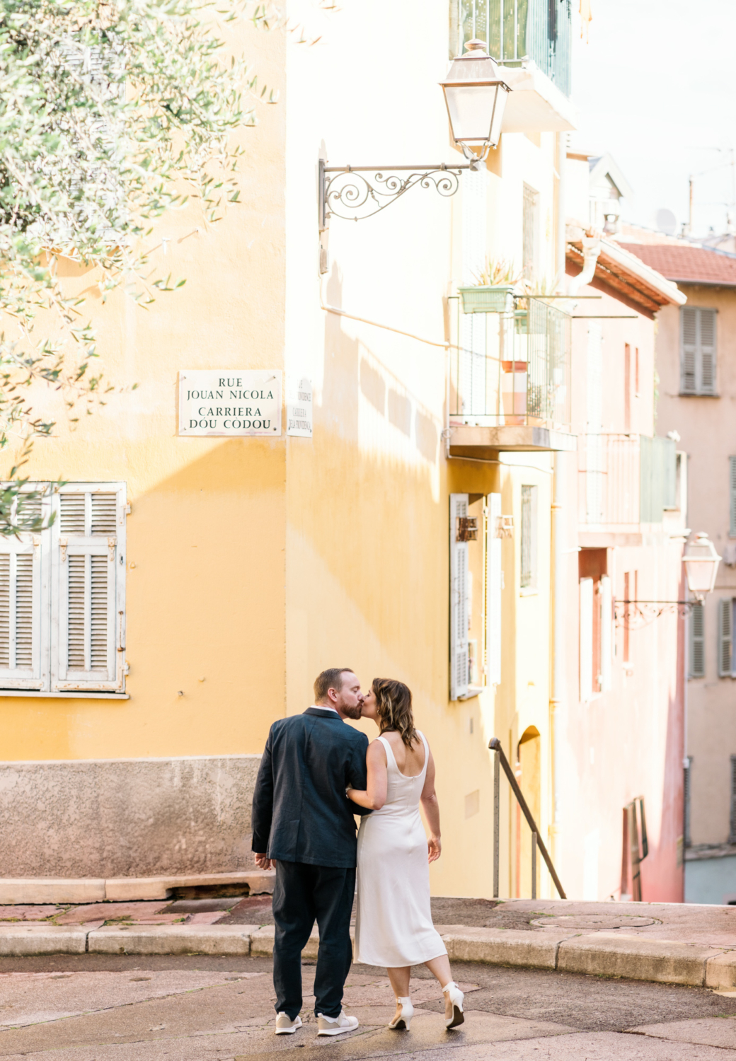 man and woman kiss on the streets of vieux nice france