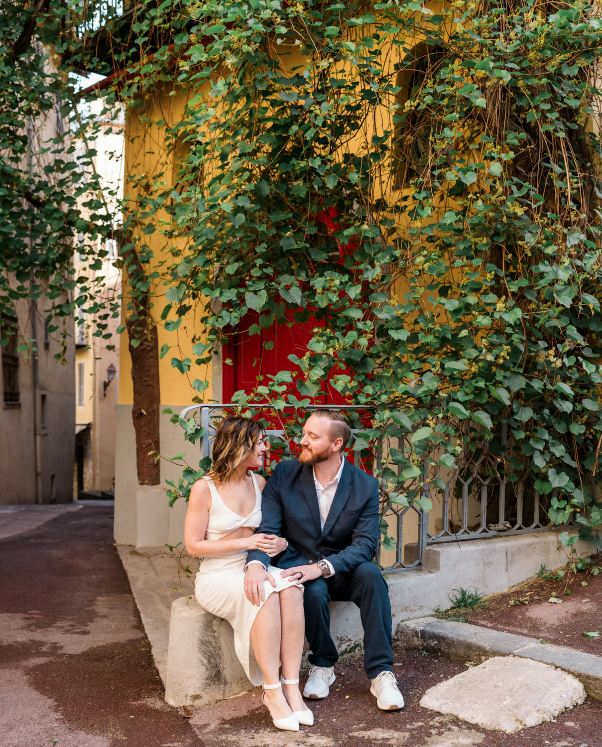 man and woman sit and smile in nice france