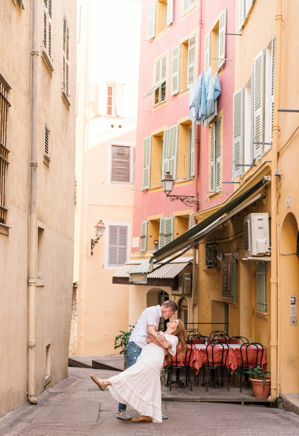 man dips woman in old town nice france