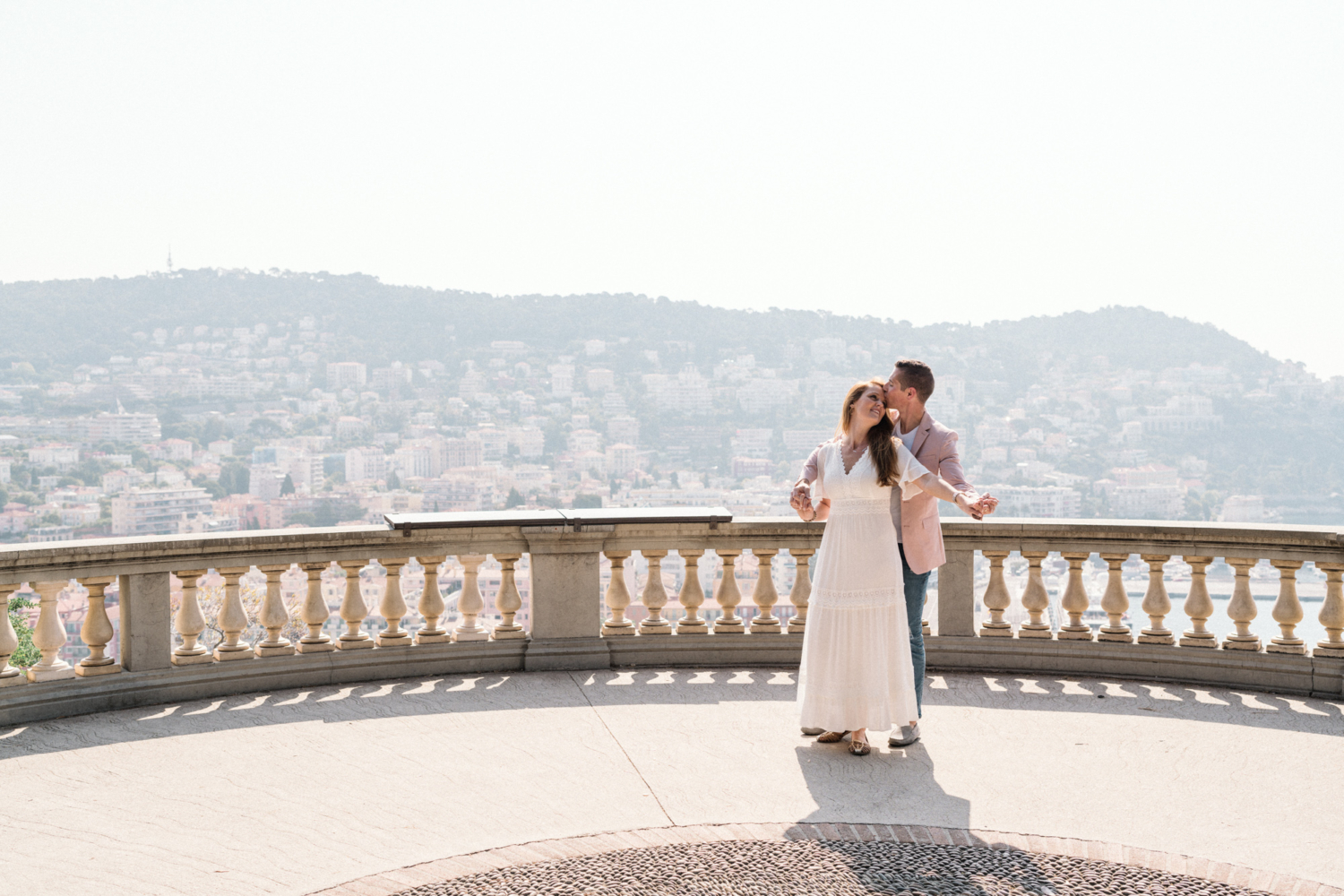 man kisses woman's forehead in nice france