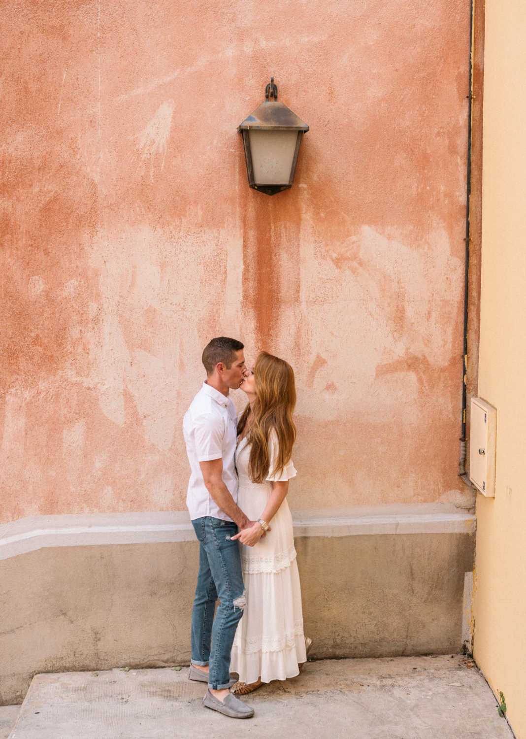 couple passionately kiss under lamp in nice france