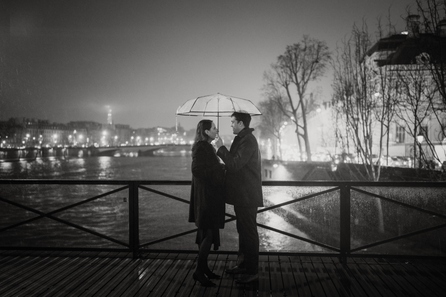 surprised woman after surprise proposal in paris rain