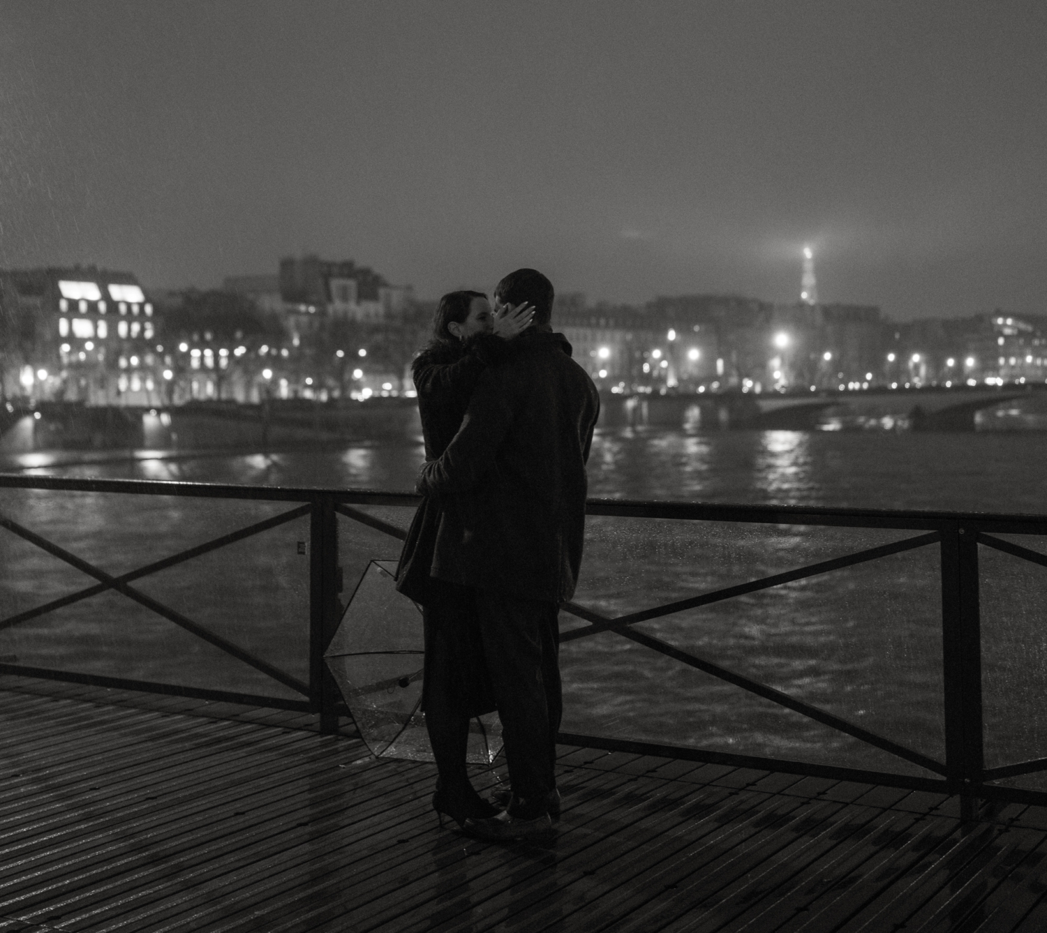 engaged couple with kiss at night in paris