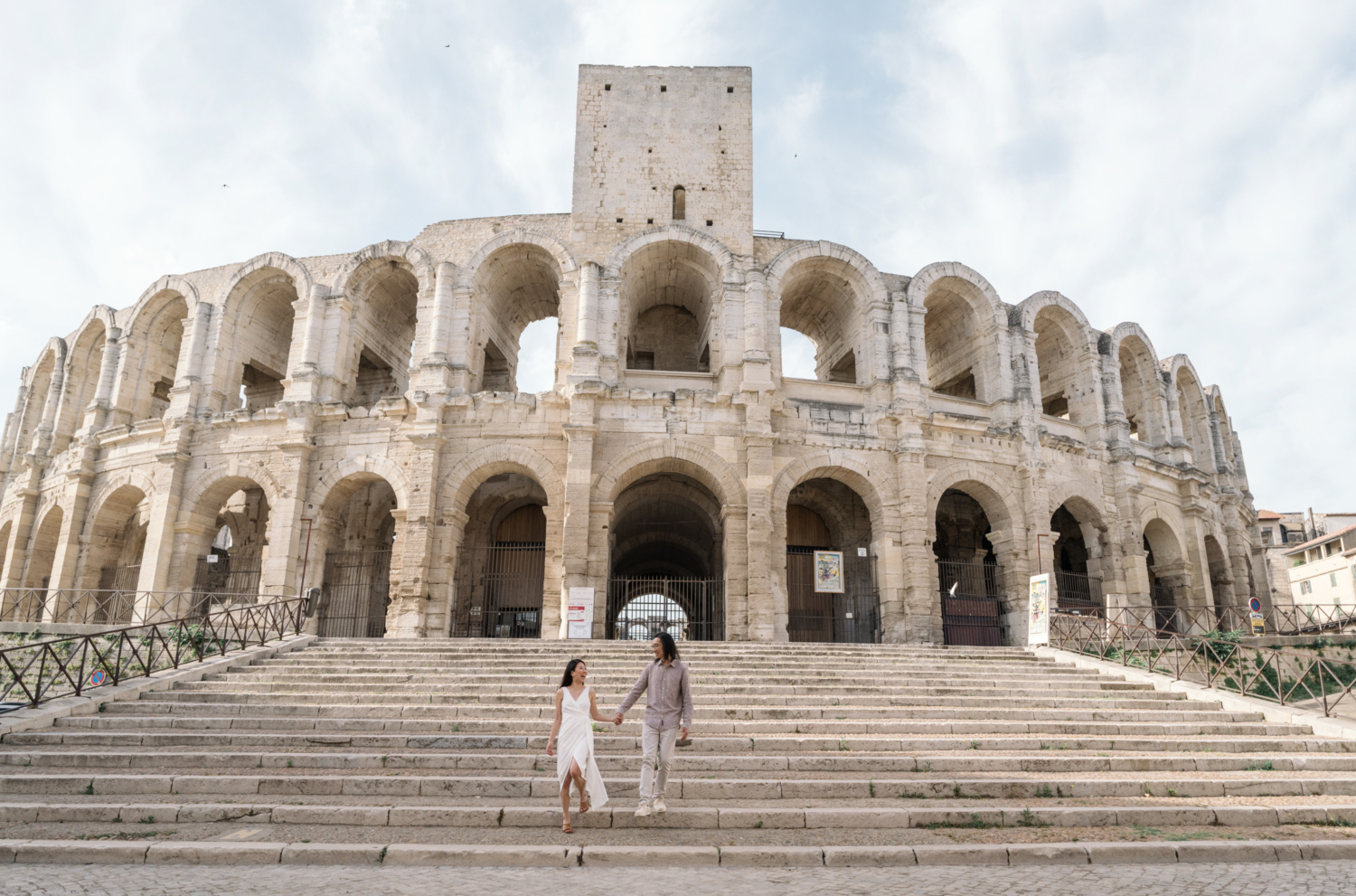 happy couple laugh at the arenes of arles france