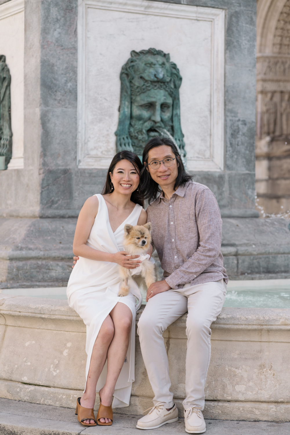 cute chinese couple pose Pomeranian dog pose in arles france