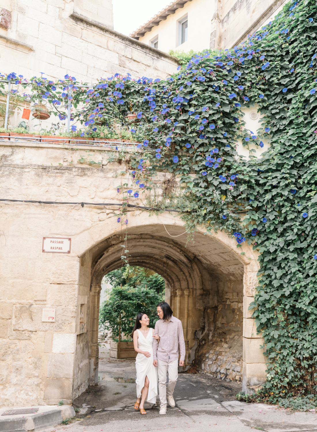 chinese couple walk arm in arm in arles france