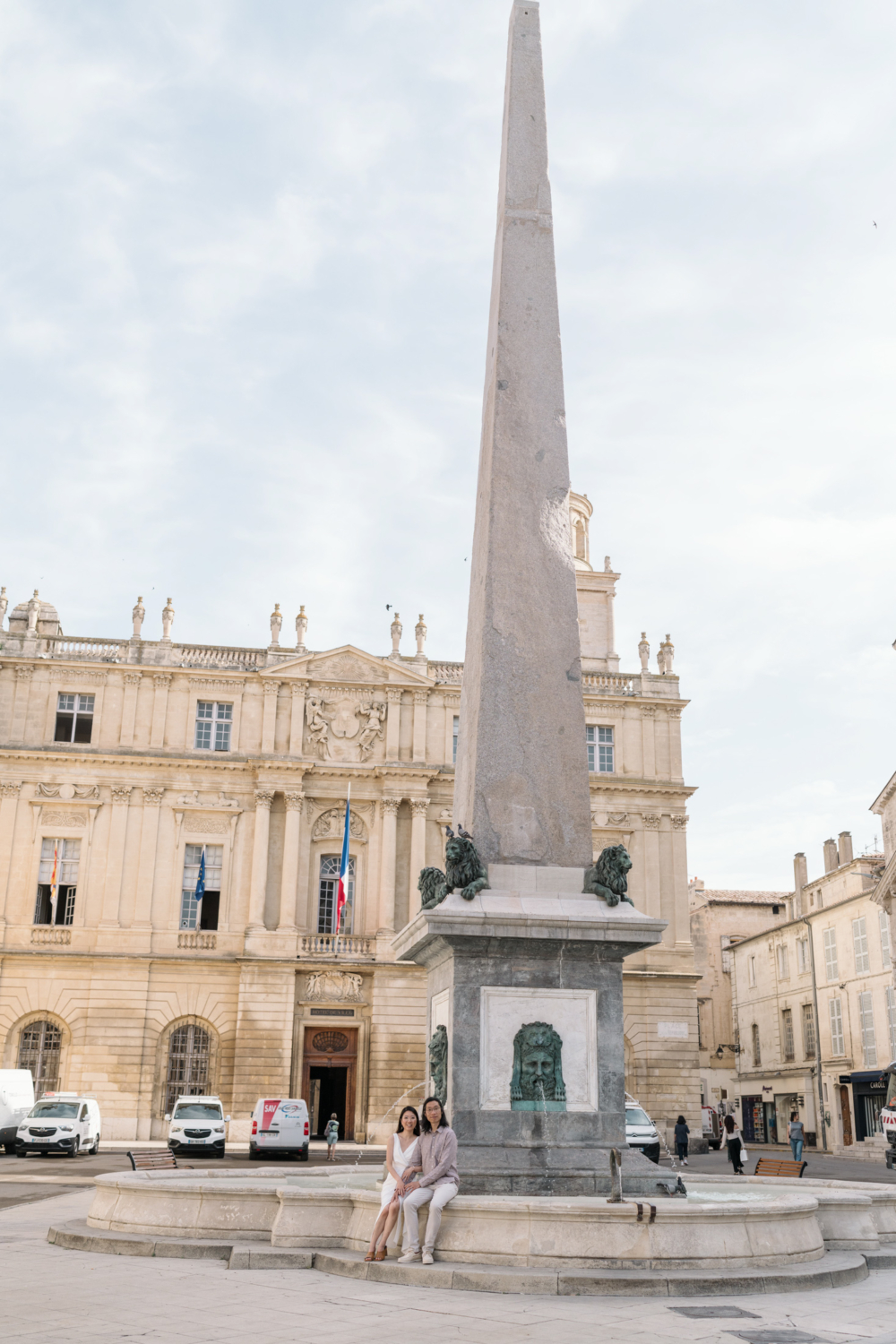 couple pose with obelisk in arles france