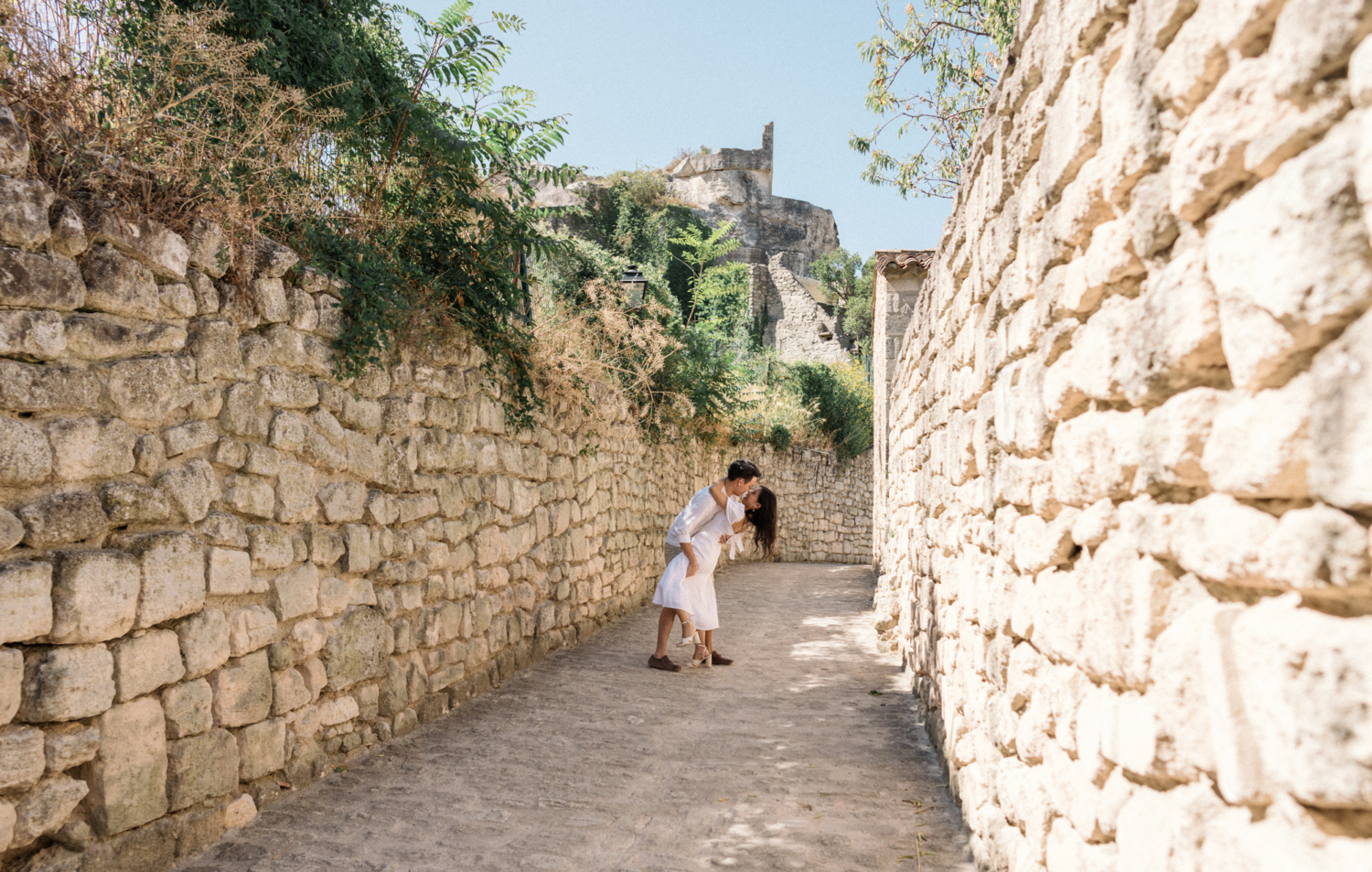 man dips woman in dance in les baux de provence