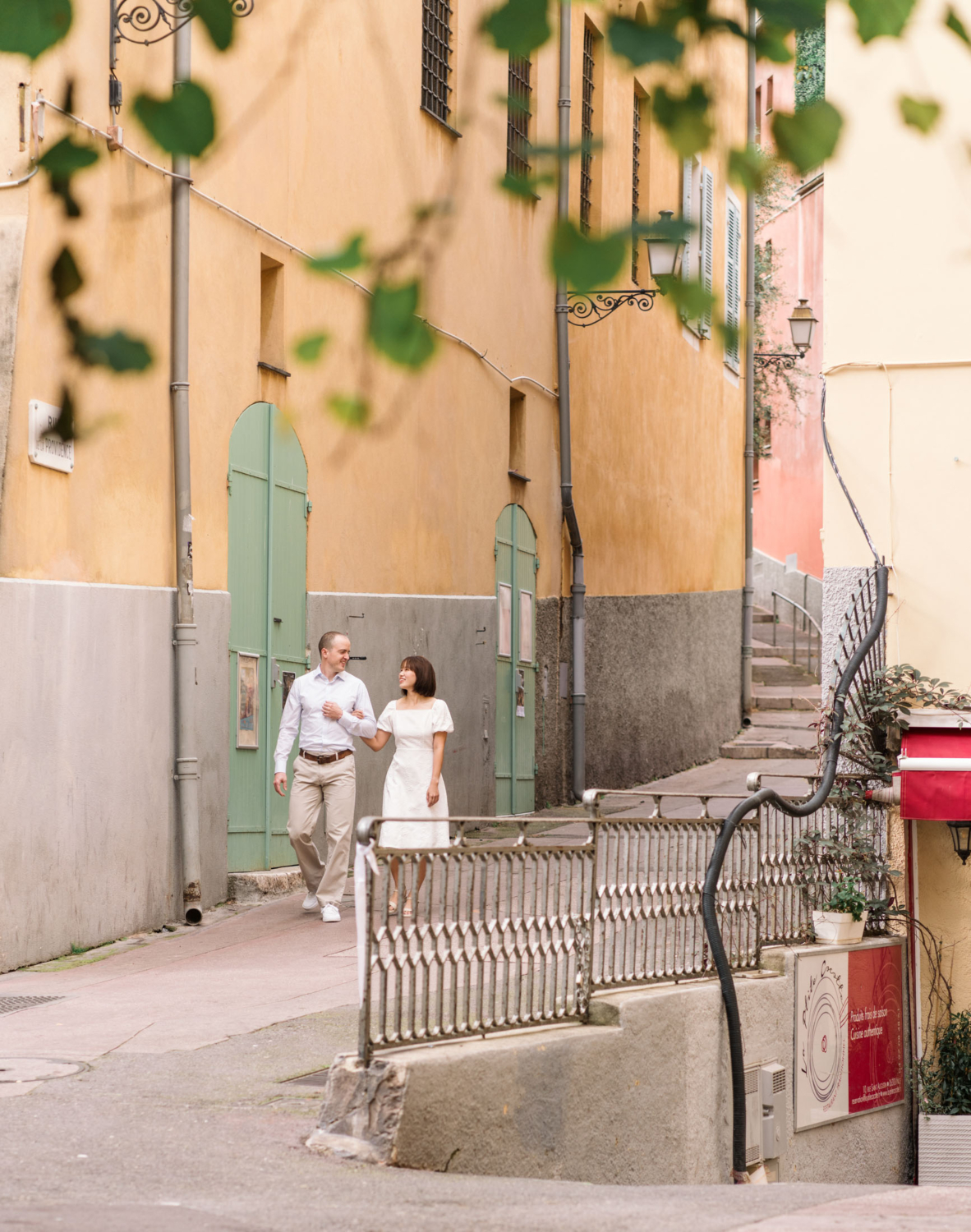 couple in love walking arm in arm in old town nice france