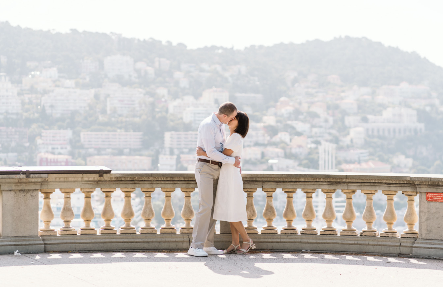 cute couple embracing and kissing in nice france