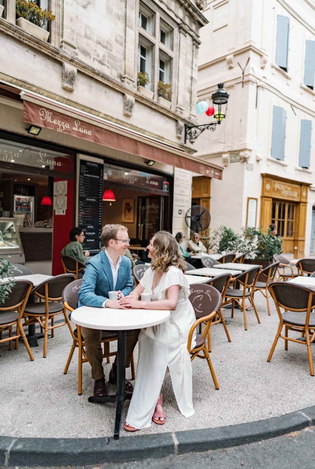 couple enjoy a coffee at cafe in arles france