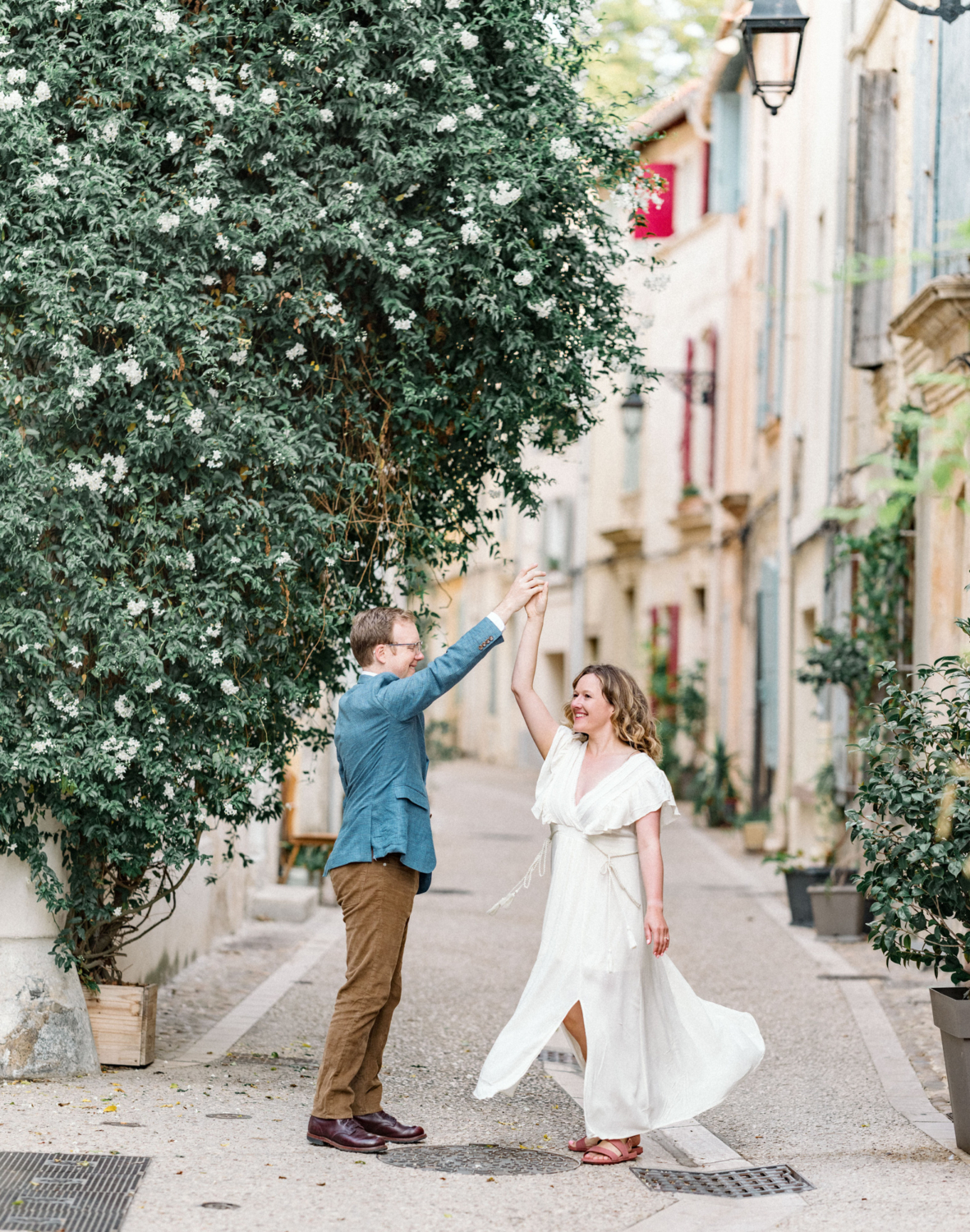 man and woman dance in colorful neighborhood in arles france