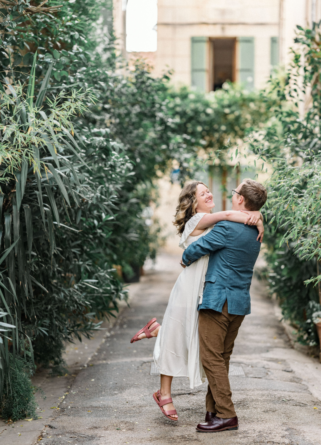 man twirls woman in circle in arles france