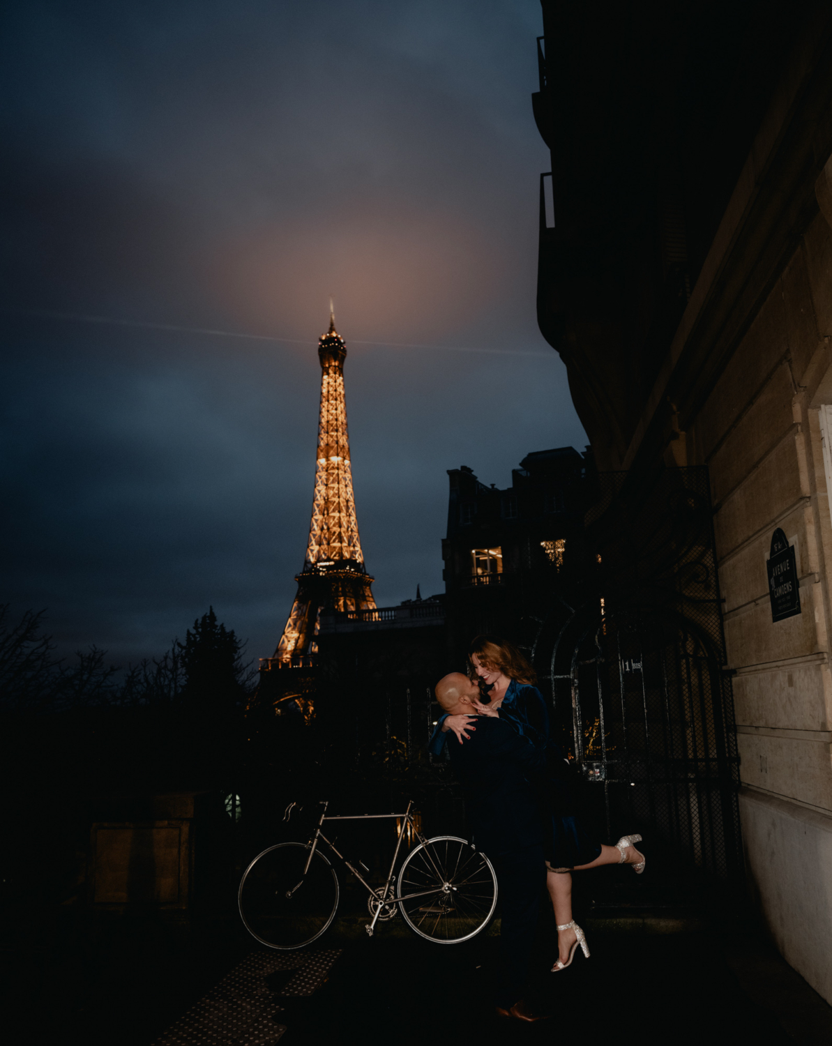 newly engaged couple have fun with view of eiffel toewr