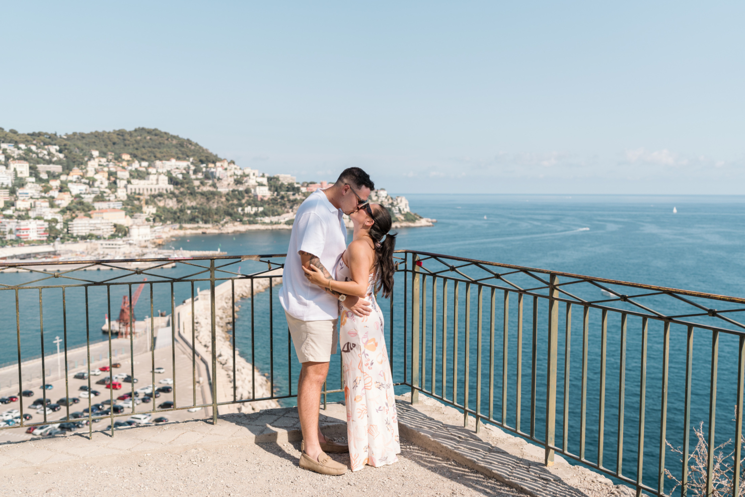 newly engaged couple passionately kiss with view of sea in nice france