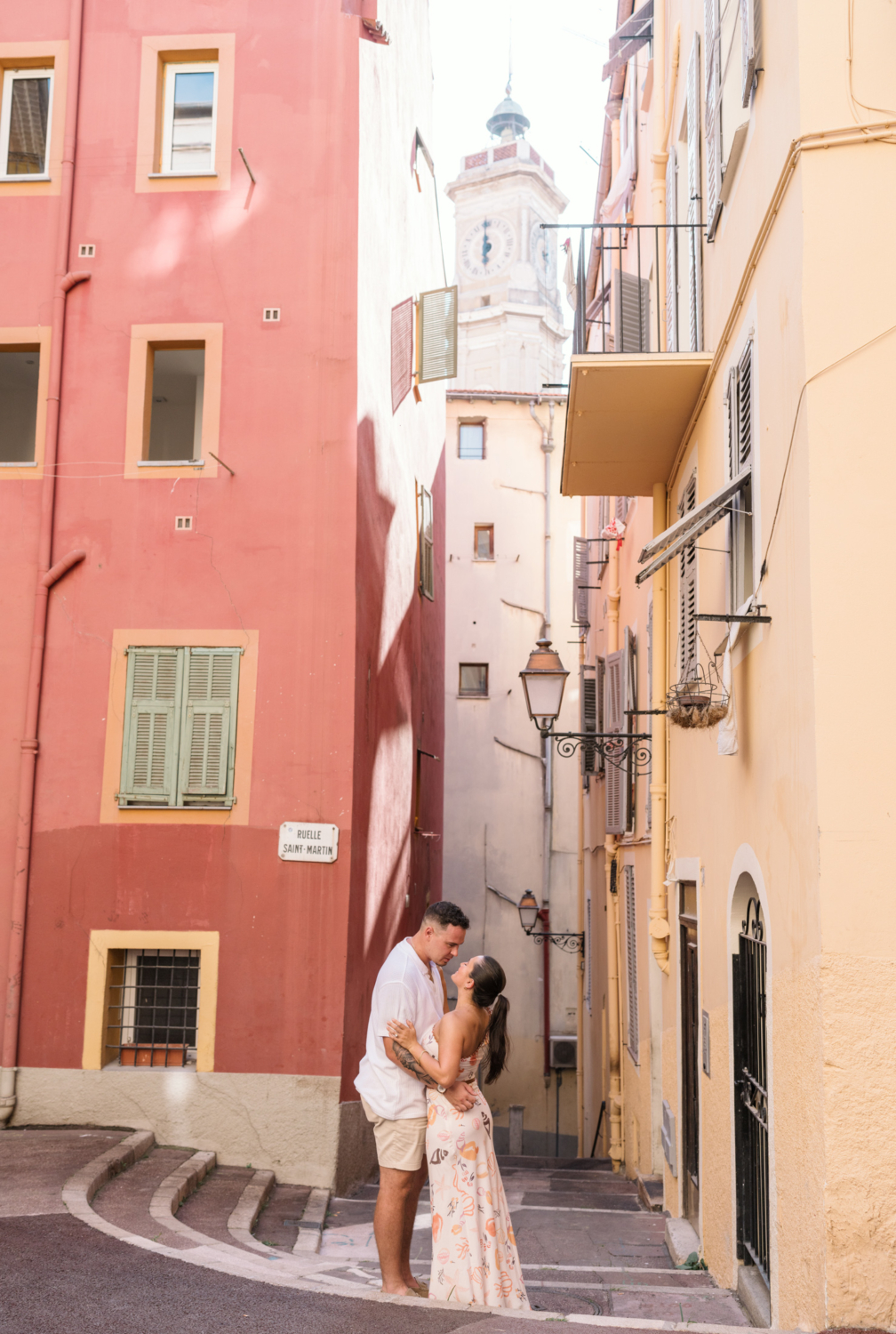 newly engaged couple embrace in old town nice france