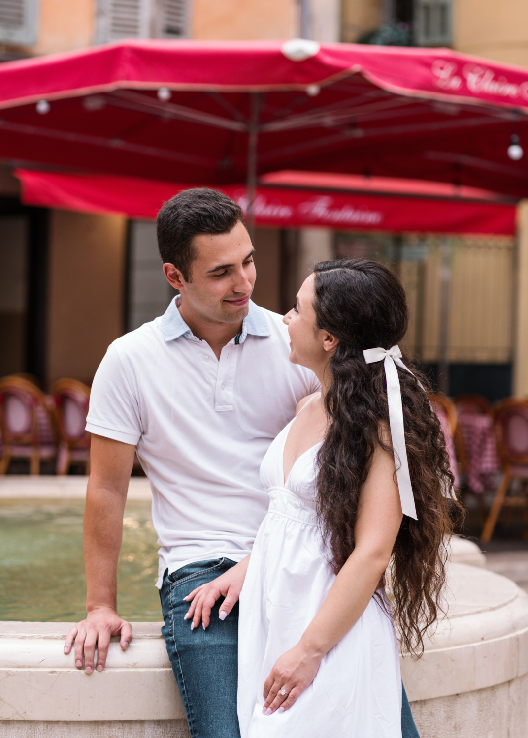 cute couple look into each other's eyes in nice france