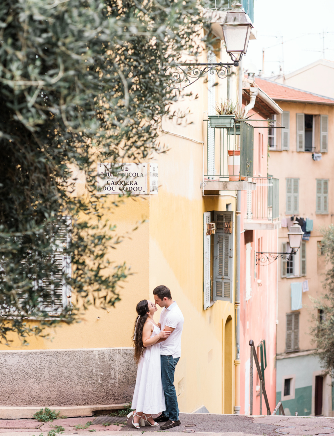 beautiful couple embrace in old town nice france