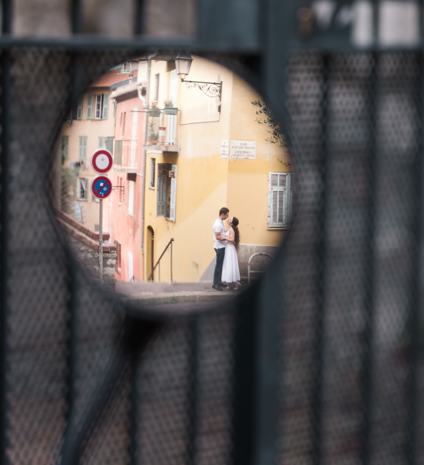 cute couple pose in reflection of vespa mirror in nice france