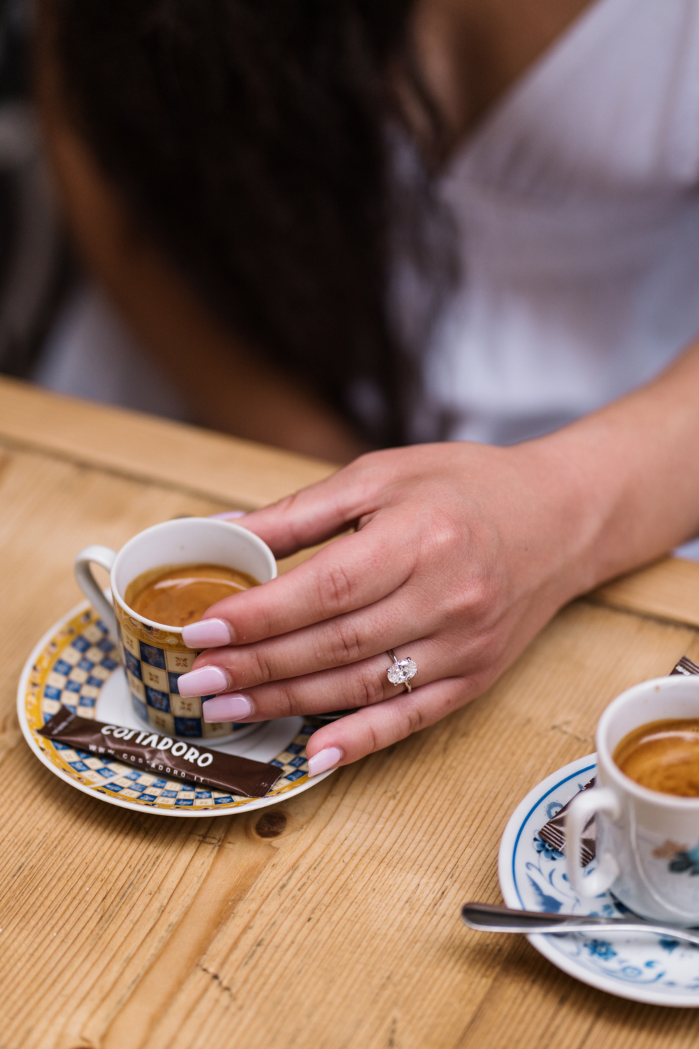 woman shows off her diamond ring