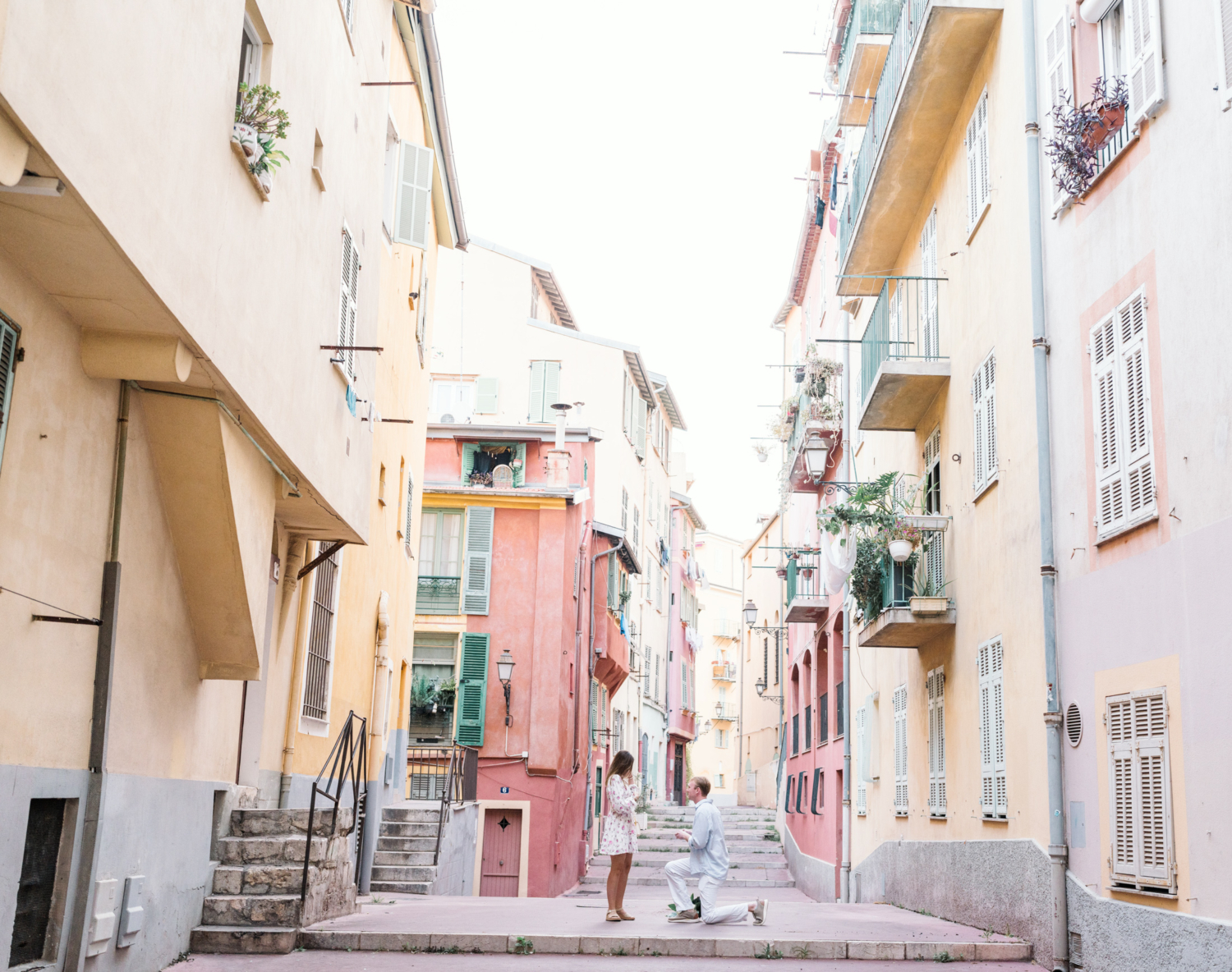 man on one knee proposes to girlfriend in nice france