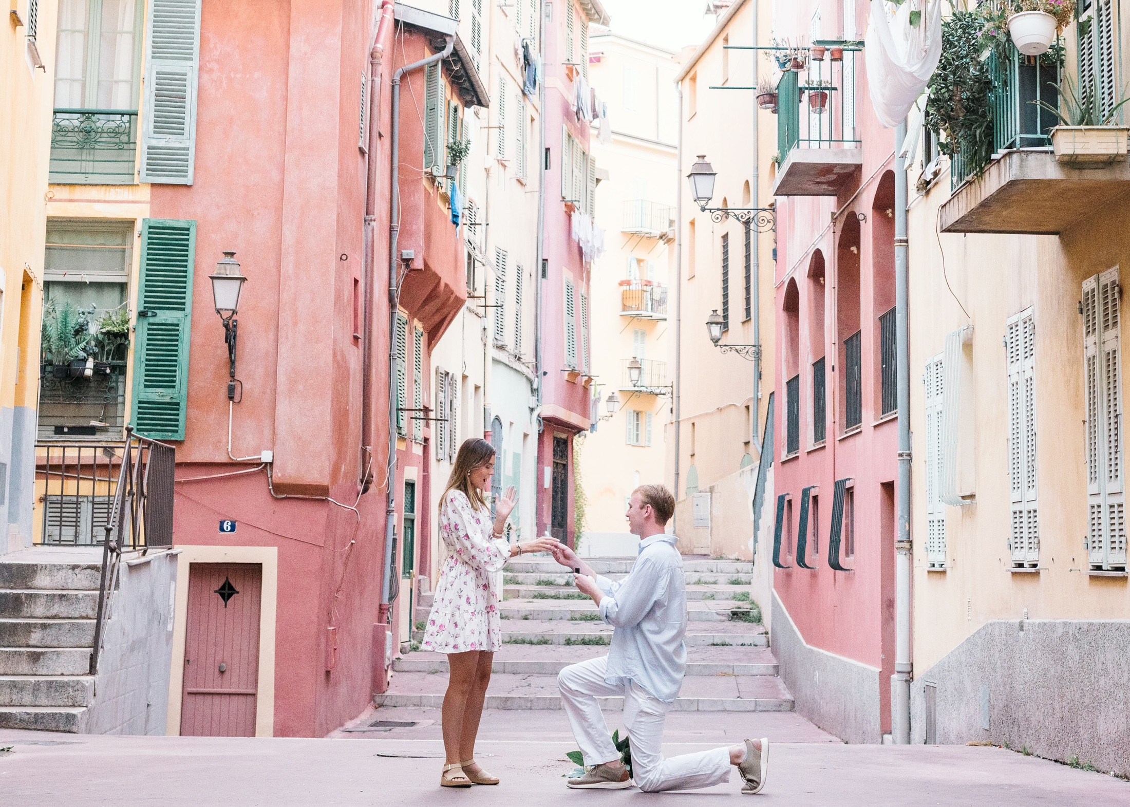 man proposes to woman in the old nice neighborhood in france