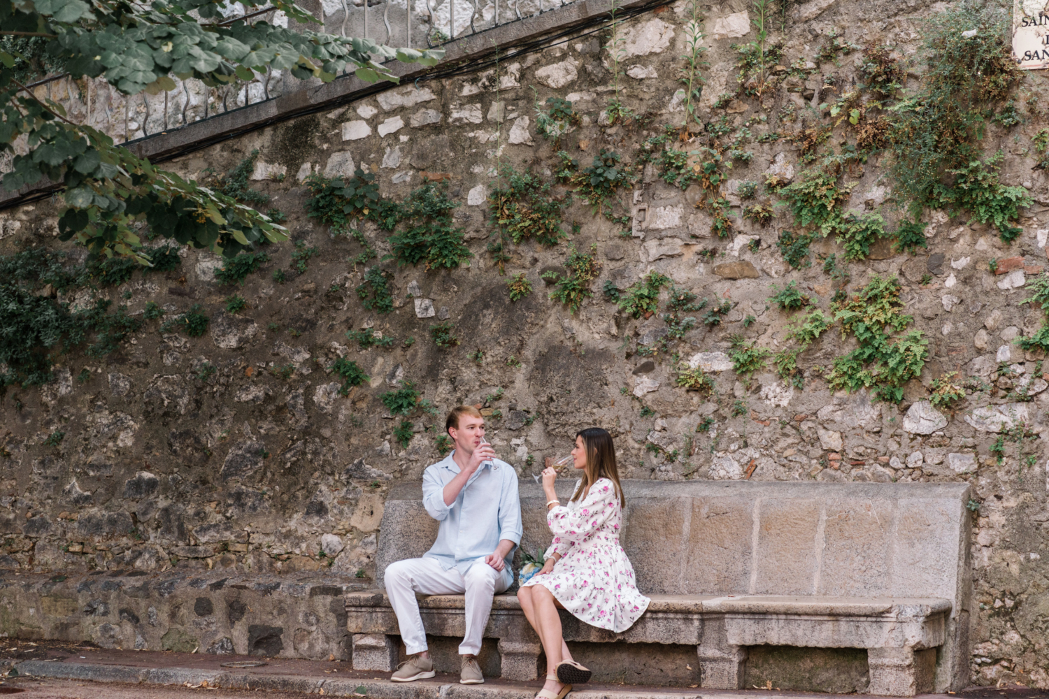 newly engaged couple sip champagne in nice france