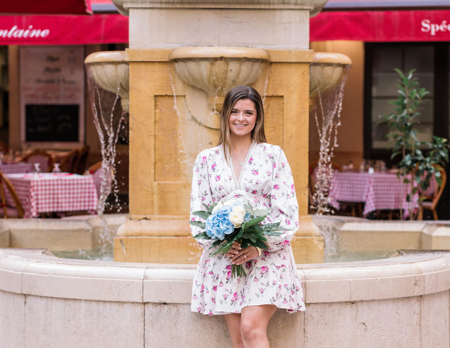 newly engaged woman holds bouquet in nice france