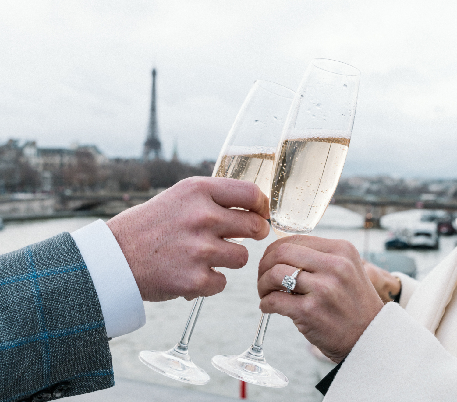 newly engaged couple toast their engagement in paris