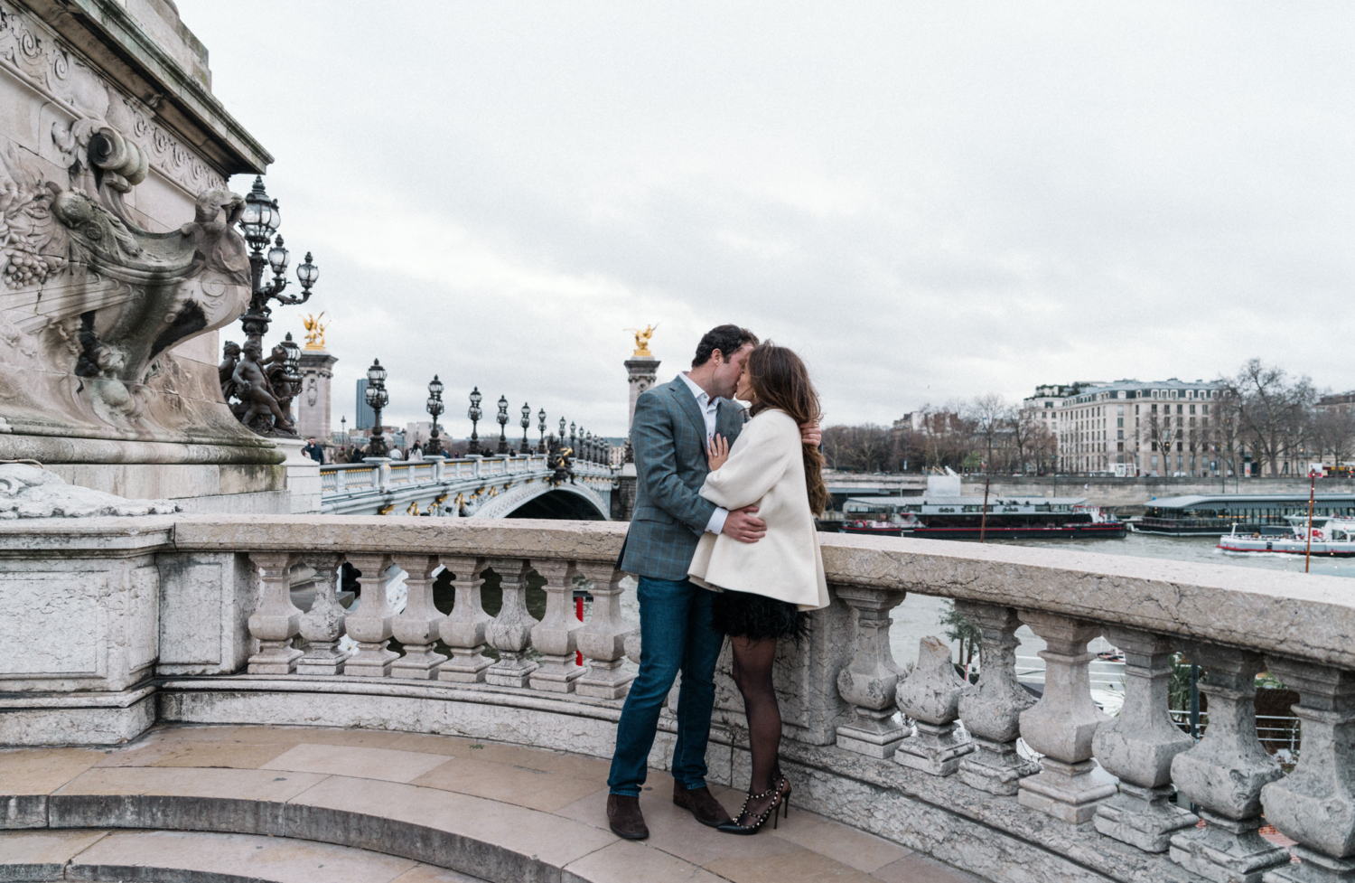 newly engaged couple kiss on the pont alexandre paris