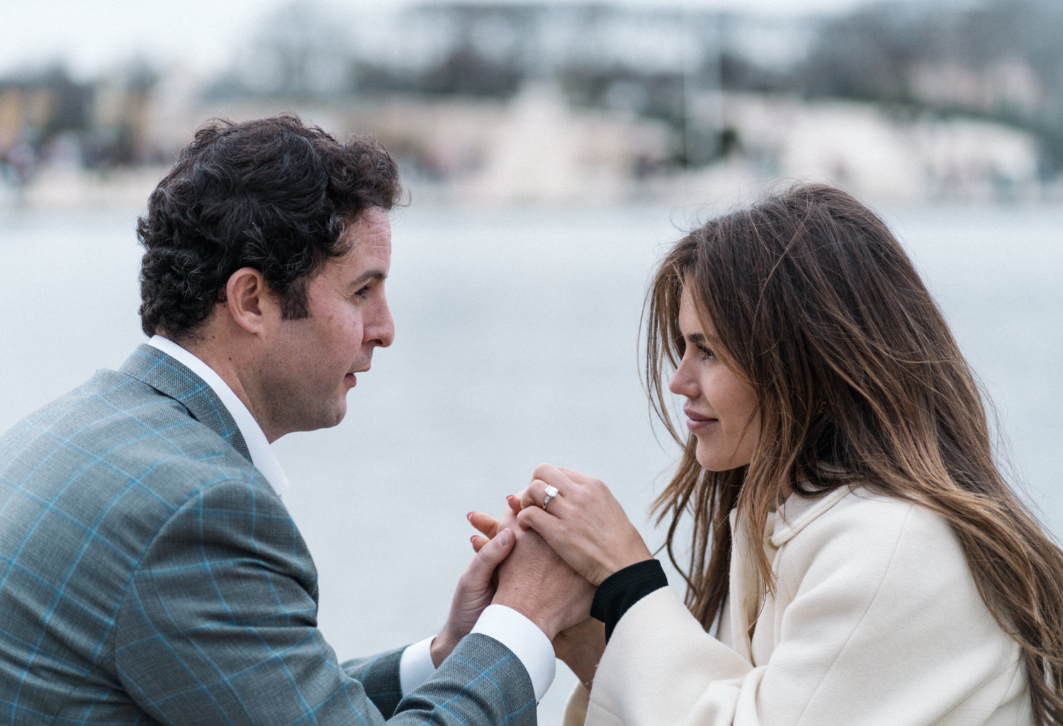 newly engaged couple hold hands in paris