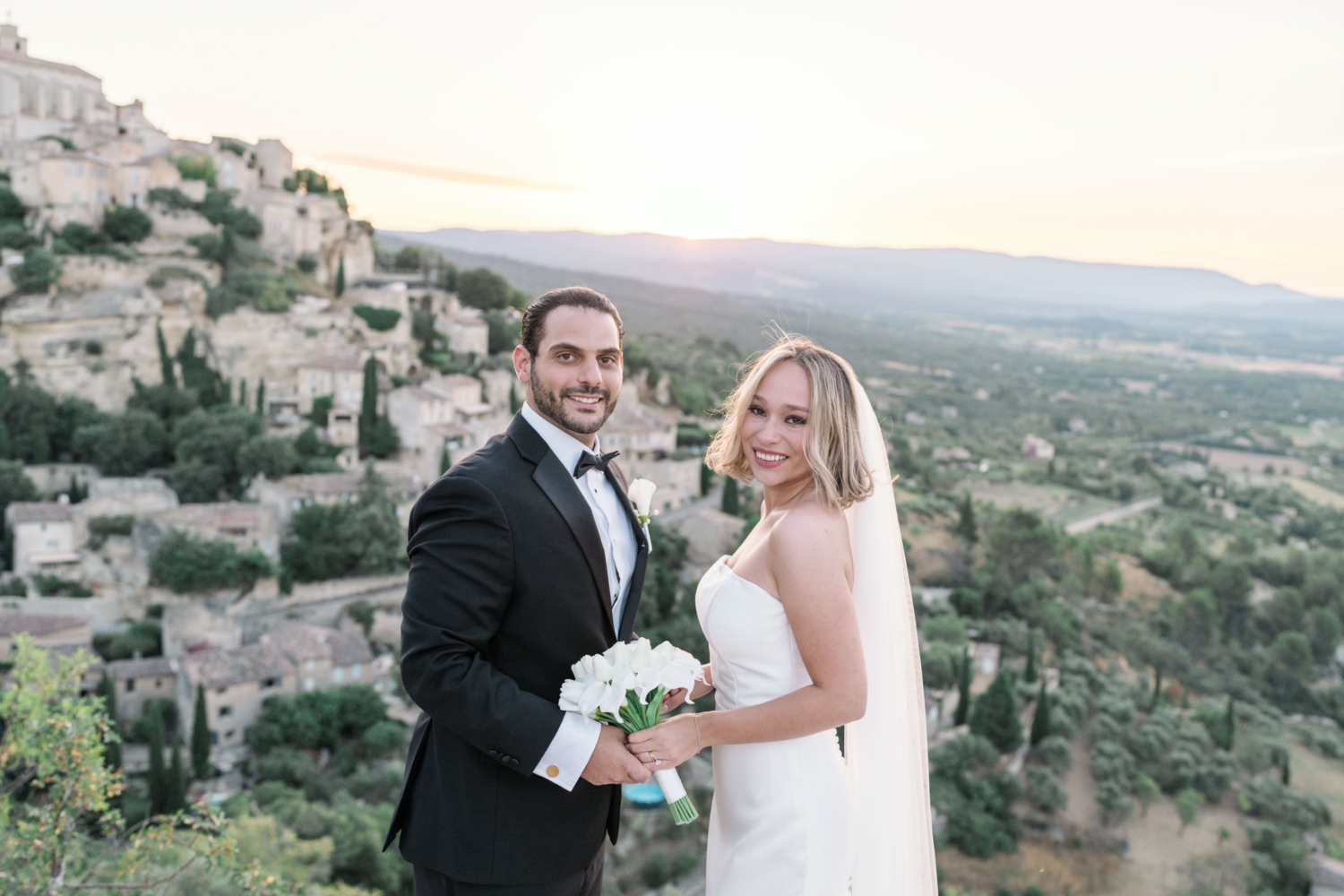 bride and groom smile on their wedding day in gordes france