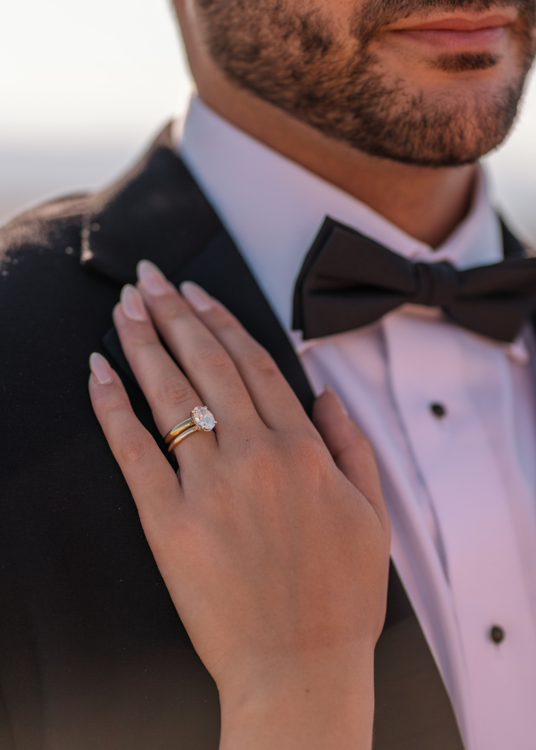 wedding ring and man's tuxedo