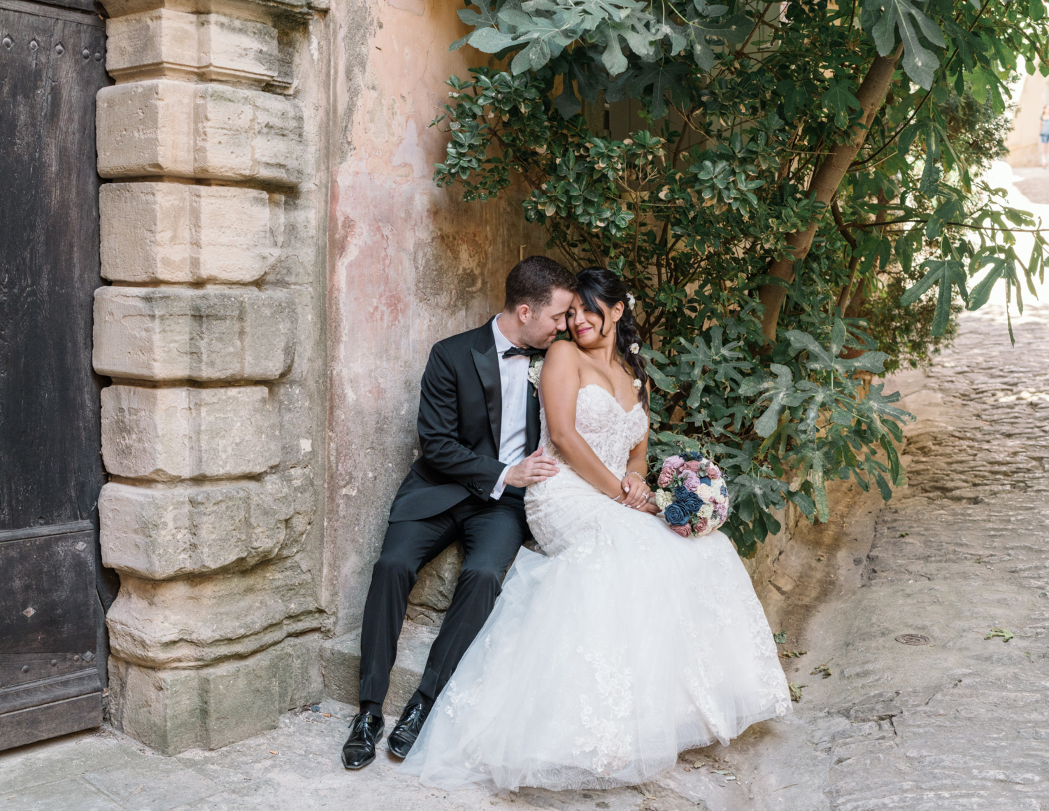 bride and groom embrace in charming gordes france