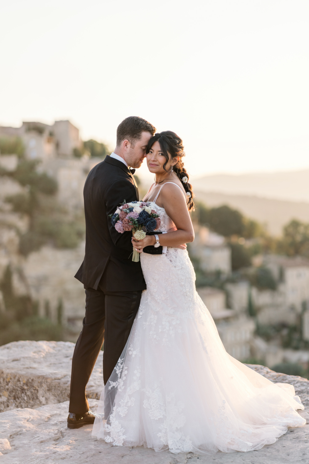 bride and groom embrace in gordes france