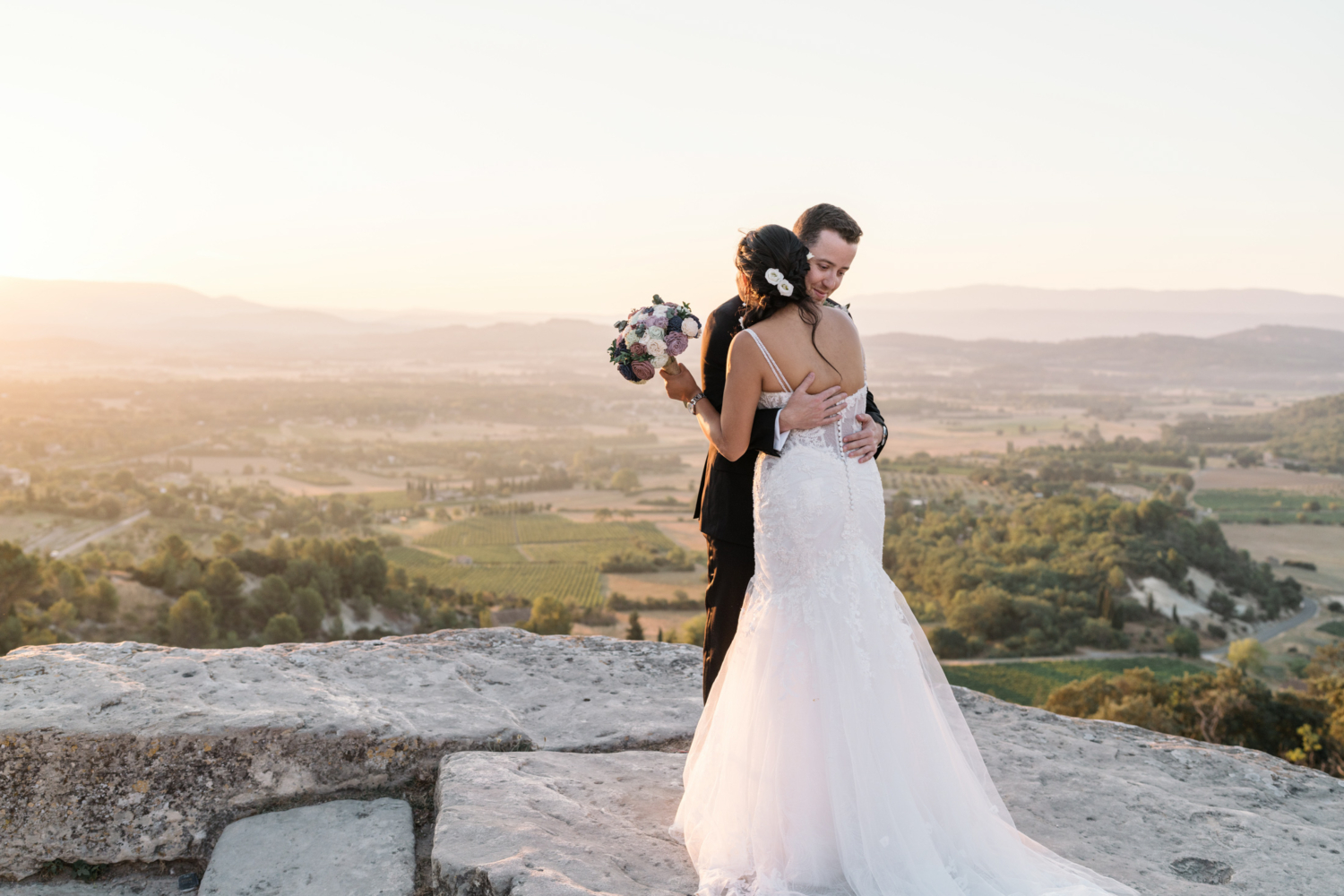 bride and groom embrace at first look in gordes france