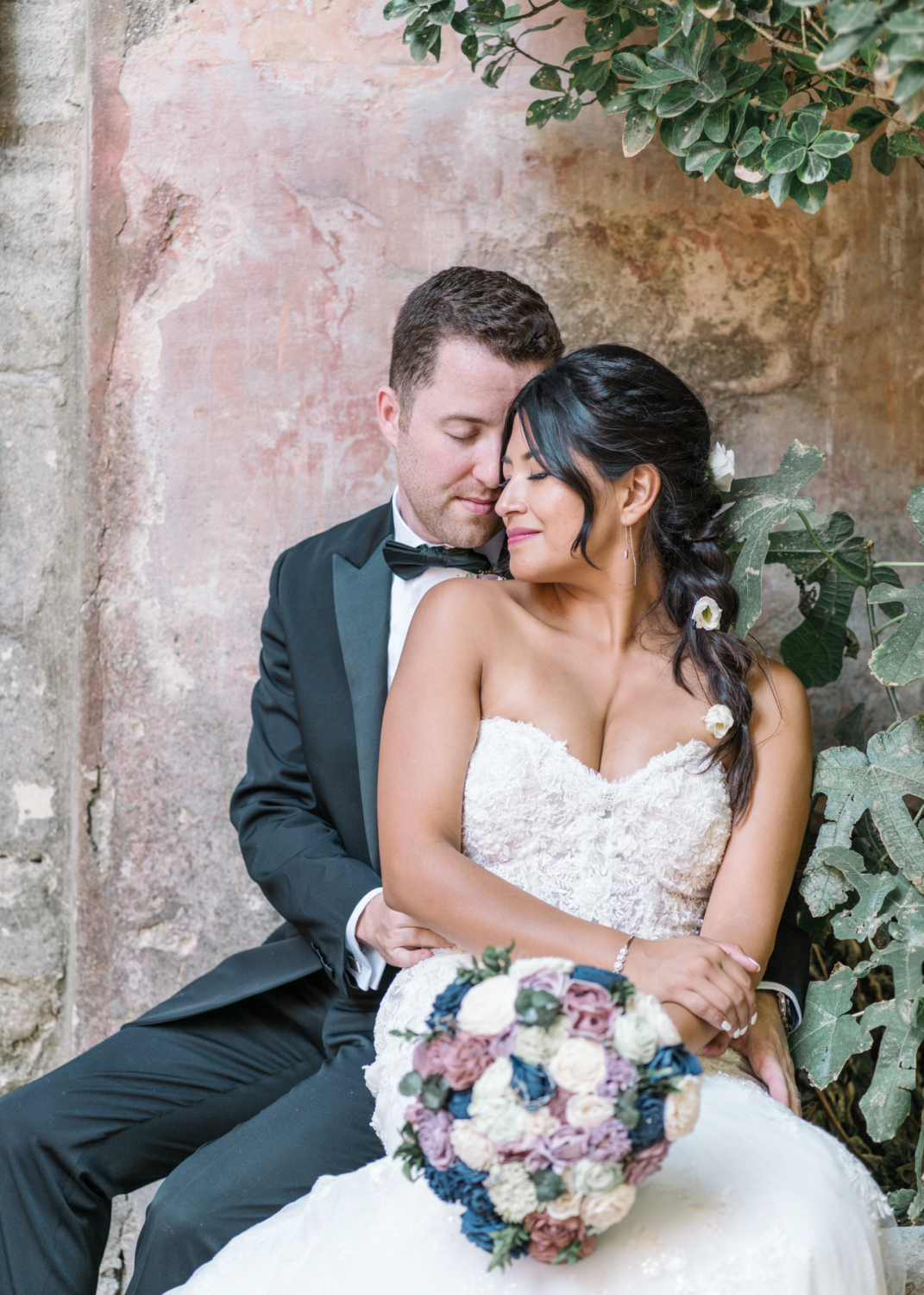 bride and groom embrace in gordes france on their wedding day