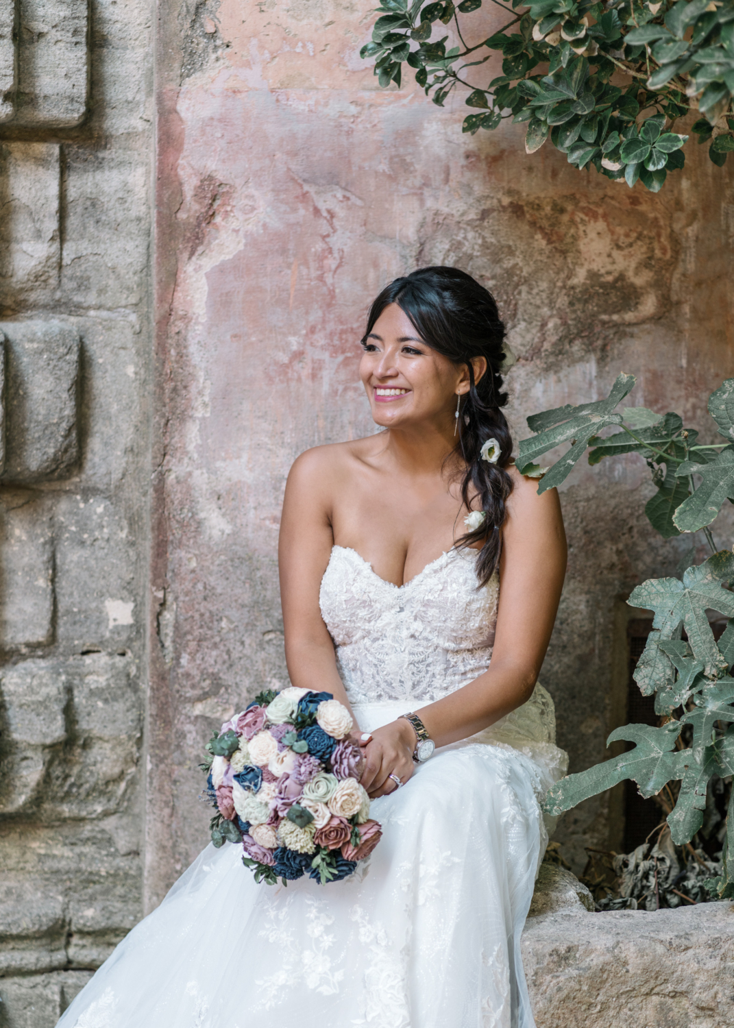 bride poses in gordes france on her wedding day