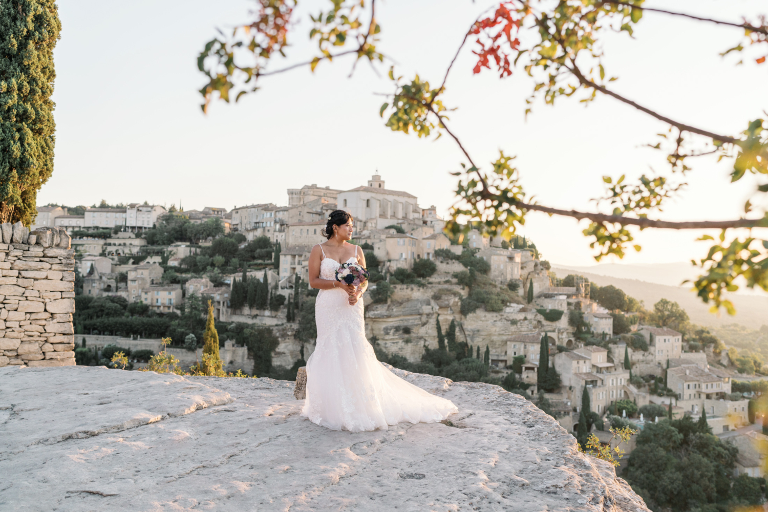 bride looks at sunrise in gordes france