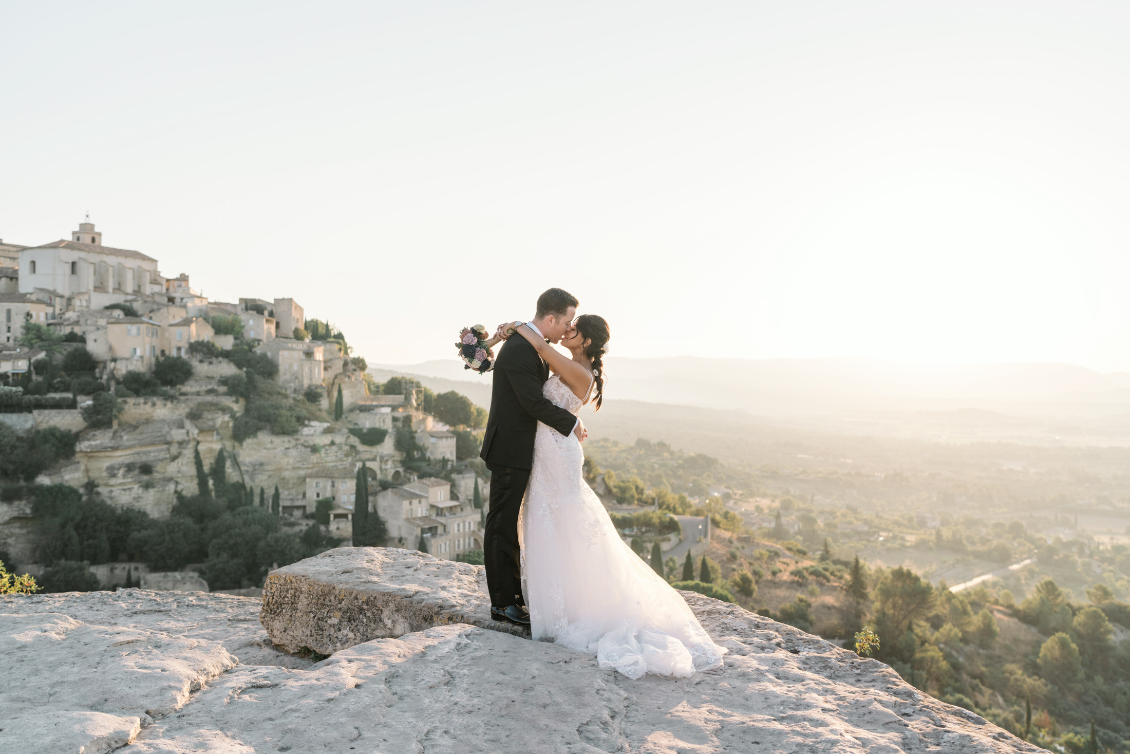 bride and groom embrace in gordes france