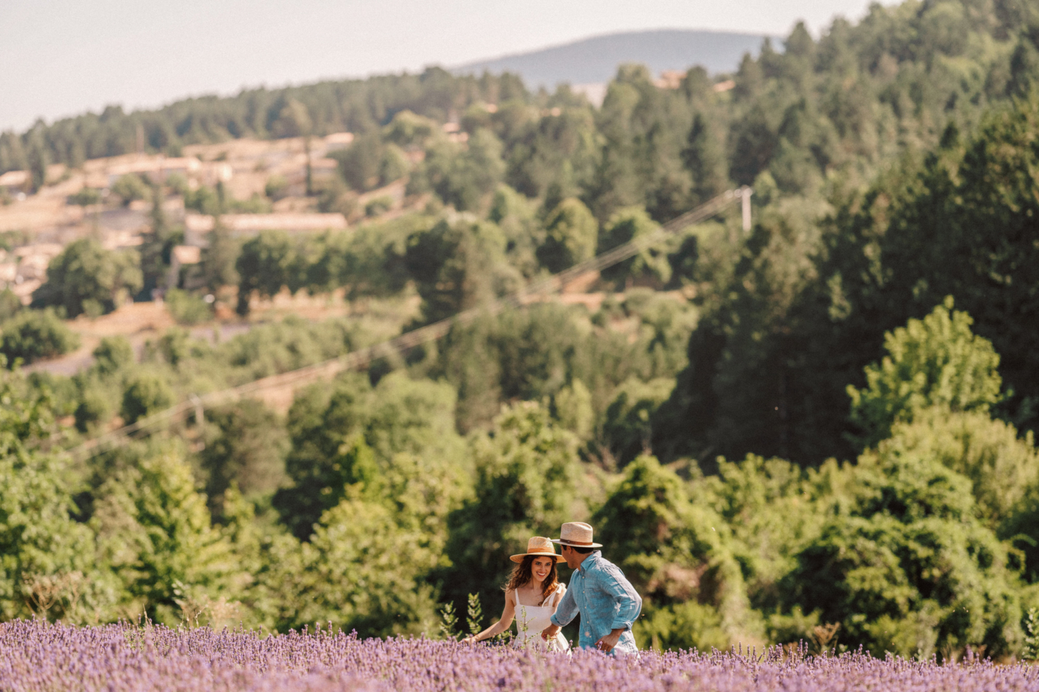 couple run through lavender field