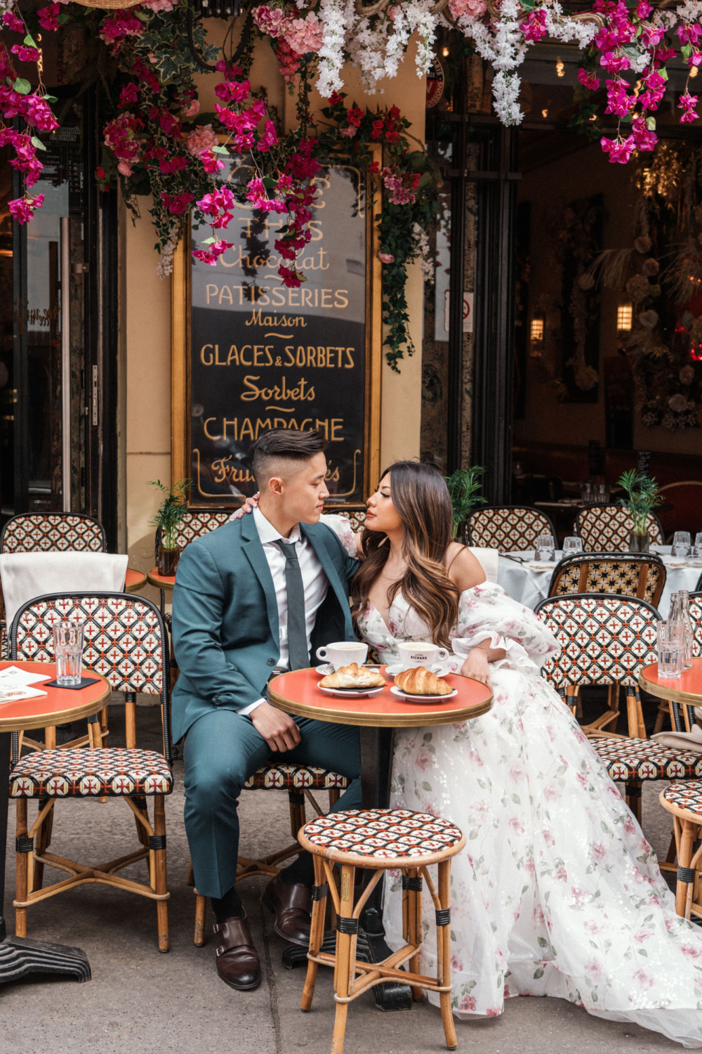 asian couple relax at classic cafe in paris france