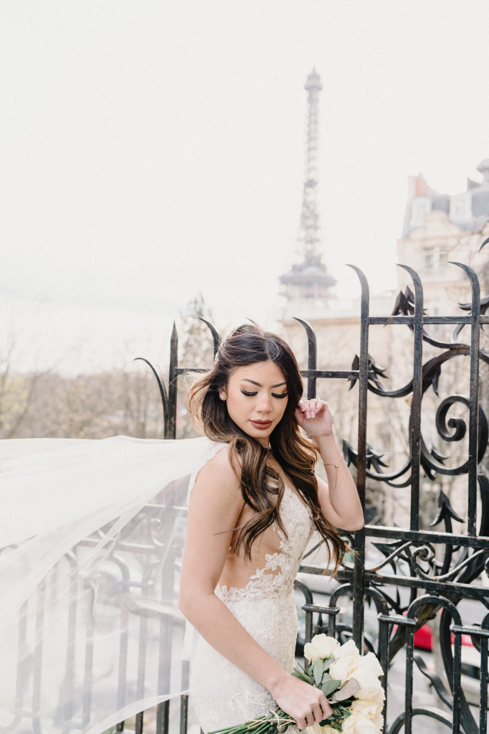 asian bride with view of eiffel tower in paris