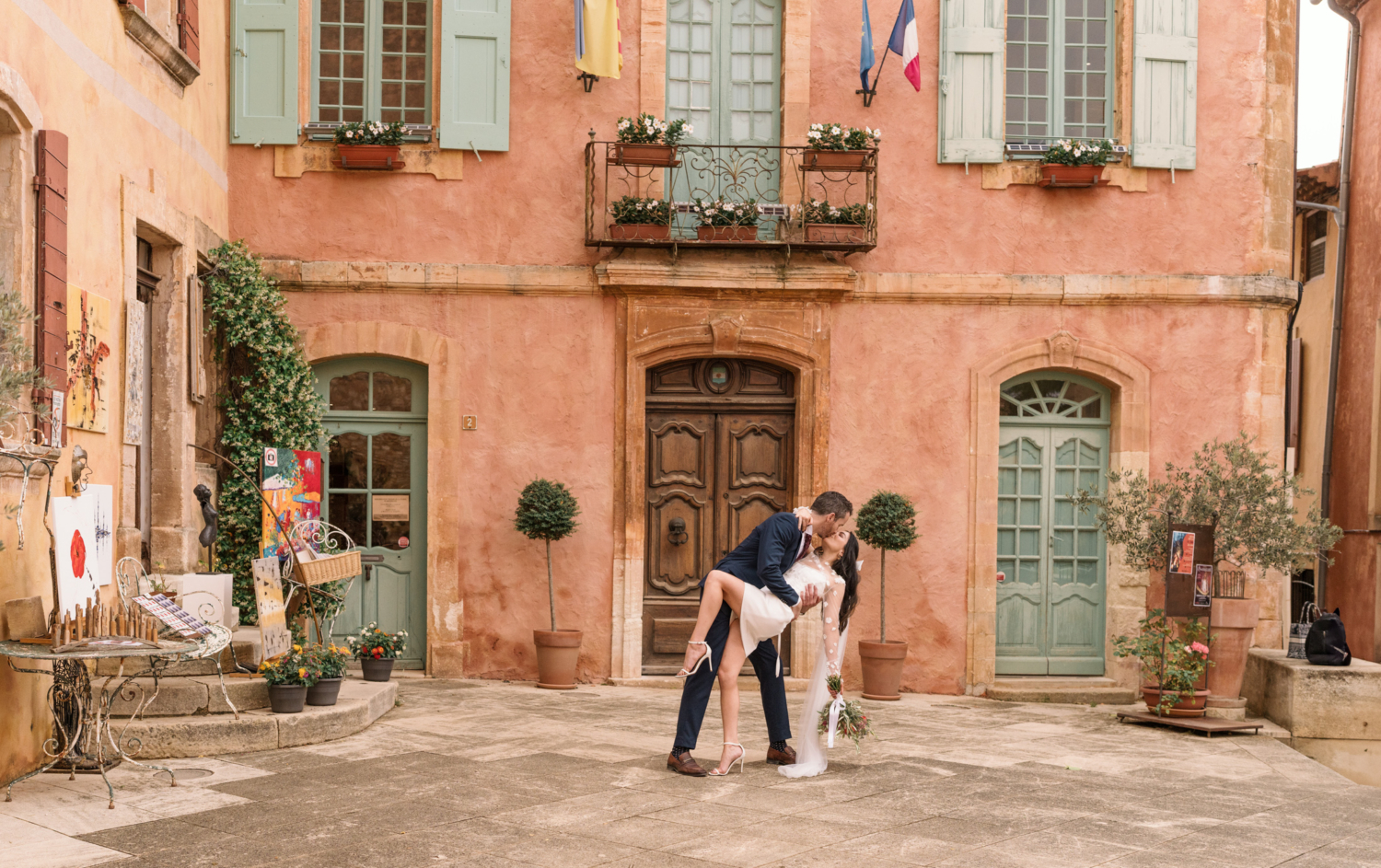 groom dips bride at city hall in roussillon france