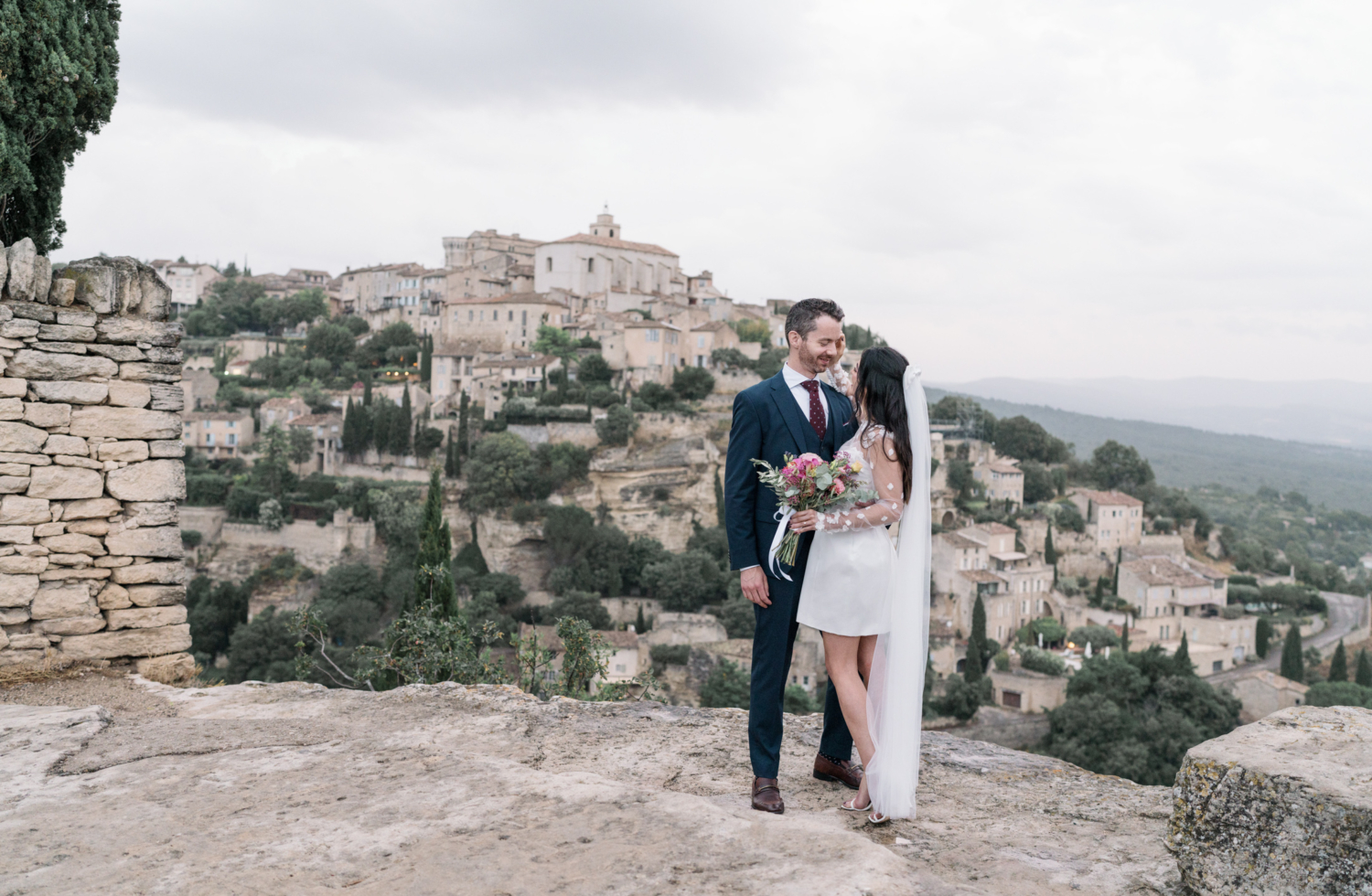 bride and groom look into each other's eyes in gordes france