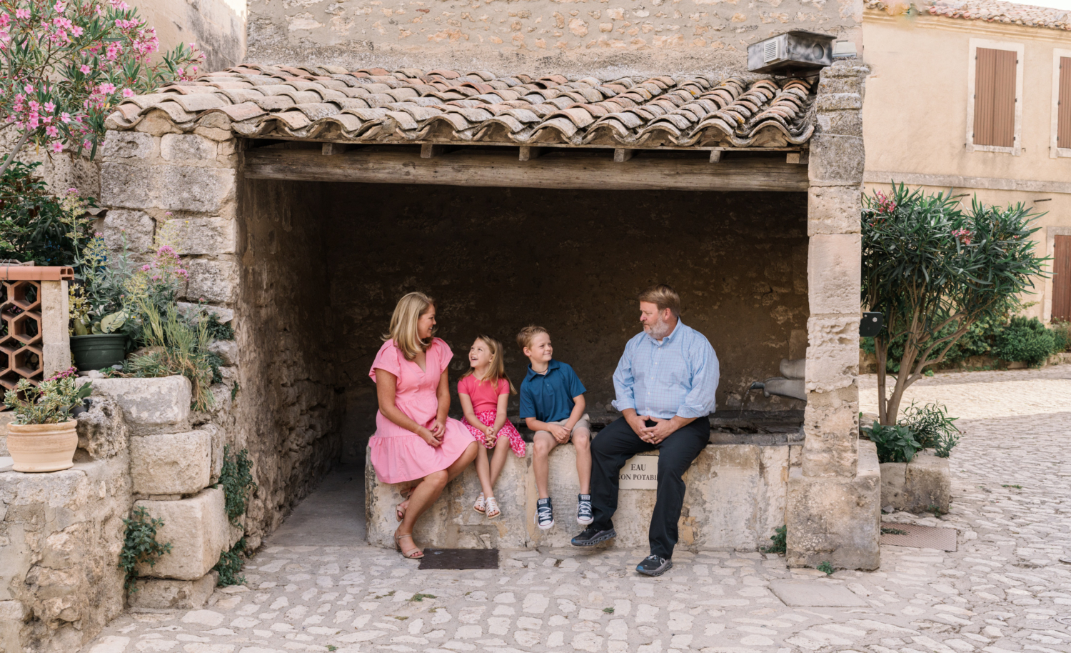 family of four have a laugh in les baux de provence france