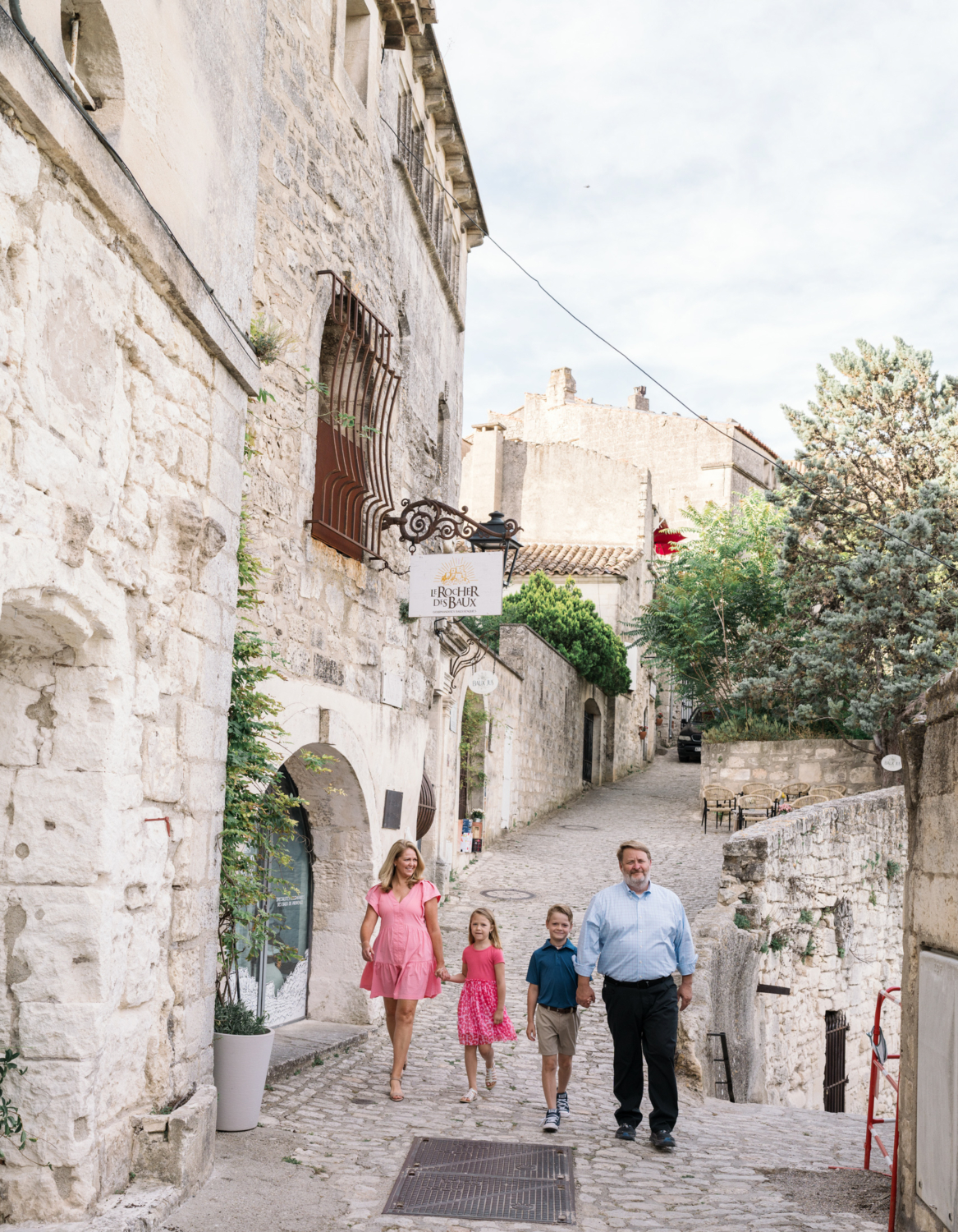 family of four walking in les baux de provence france