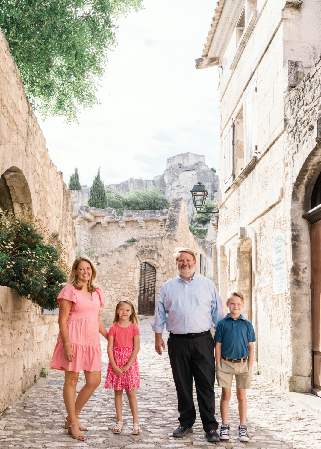 cute family poses on medieval streets of les baux de provence france